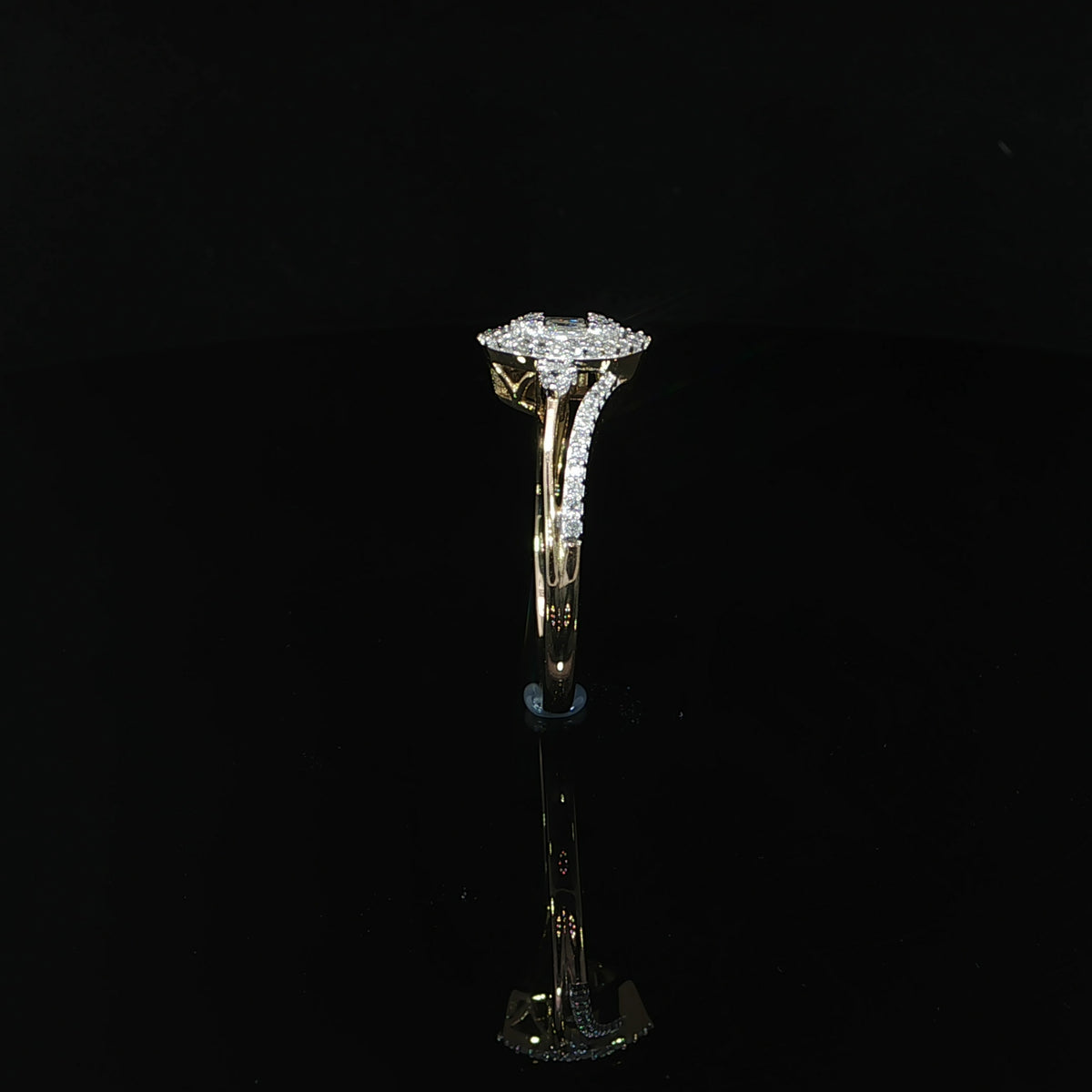 Standing side view of a 0.29 CTW natural diamond halo ring in 10K yellow gold with a polished lower band.
