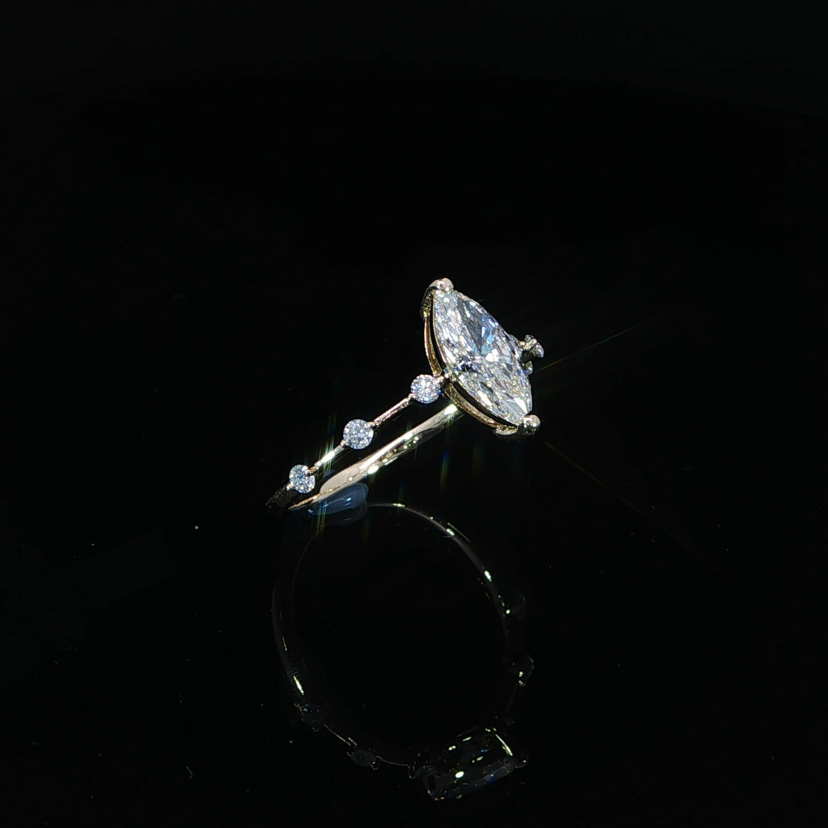 Marquise engagement ring with 1.20 total carats of lab-grown diamonds in 14K yellow gold.