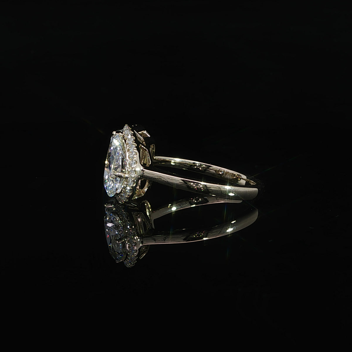Toi et Moi ring featuring a 1.55 carat emerald cut diamond and 1.32 carat pear shaped diamond.