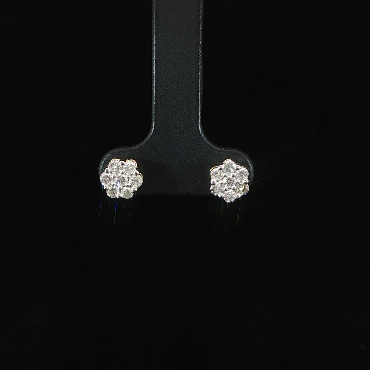 Front view of round diamond cluster earrings in 10K yellow gold