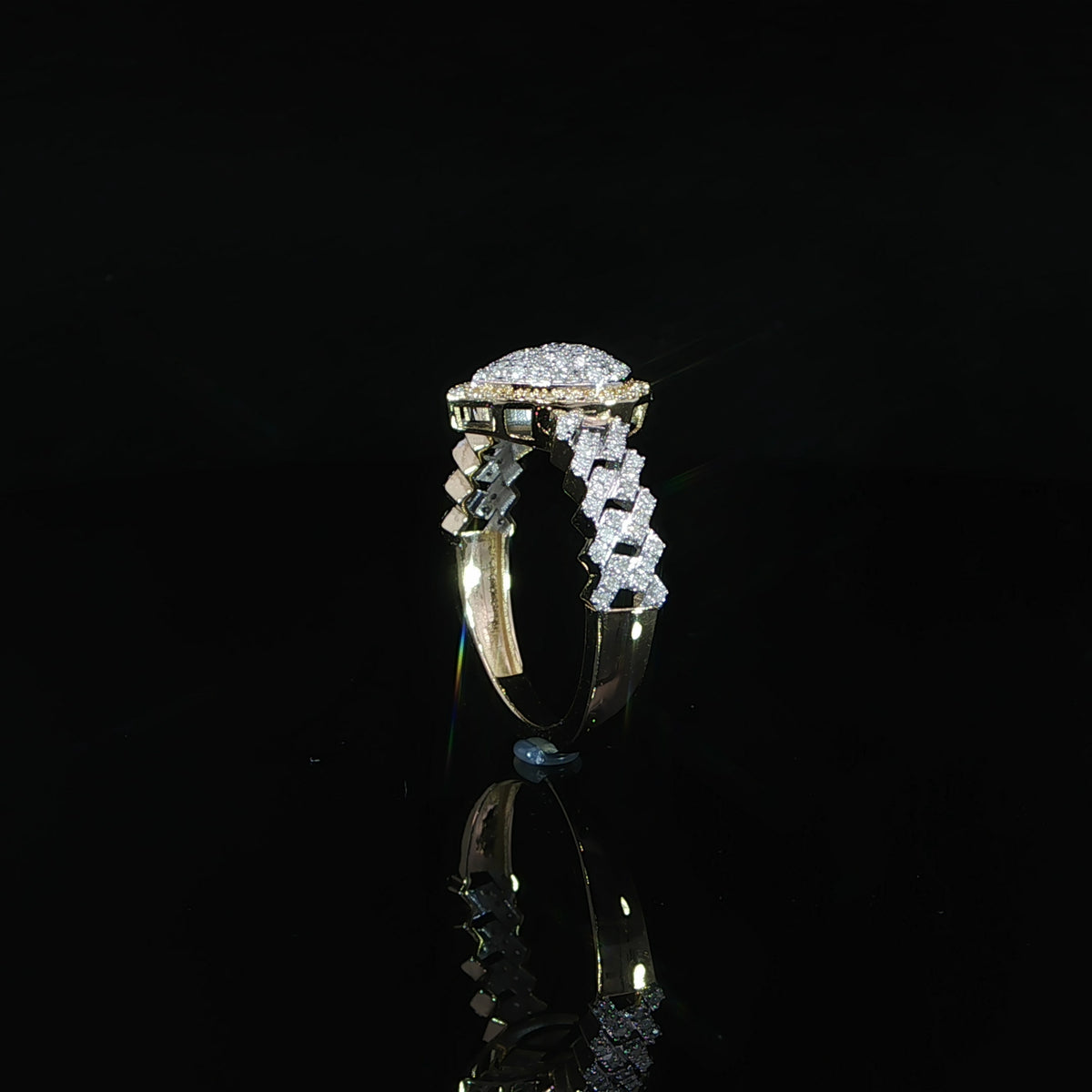 Profile of a 10K yellow gold 0.38 CTW diamond ring showing interlocking shoulders and a polished lower band.