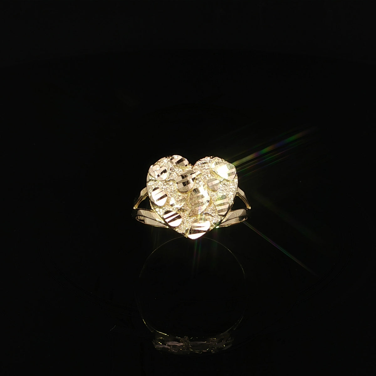 Front view highlighting the 14mm textured heart face of a yellow gold nugget ring.