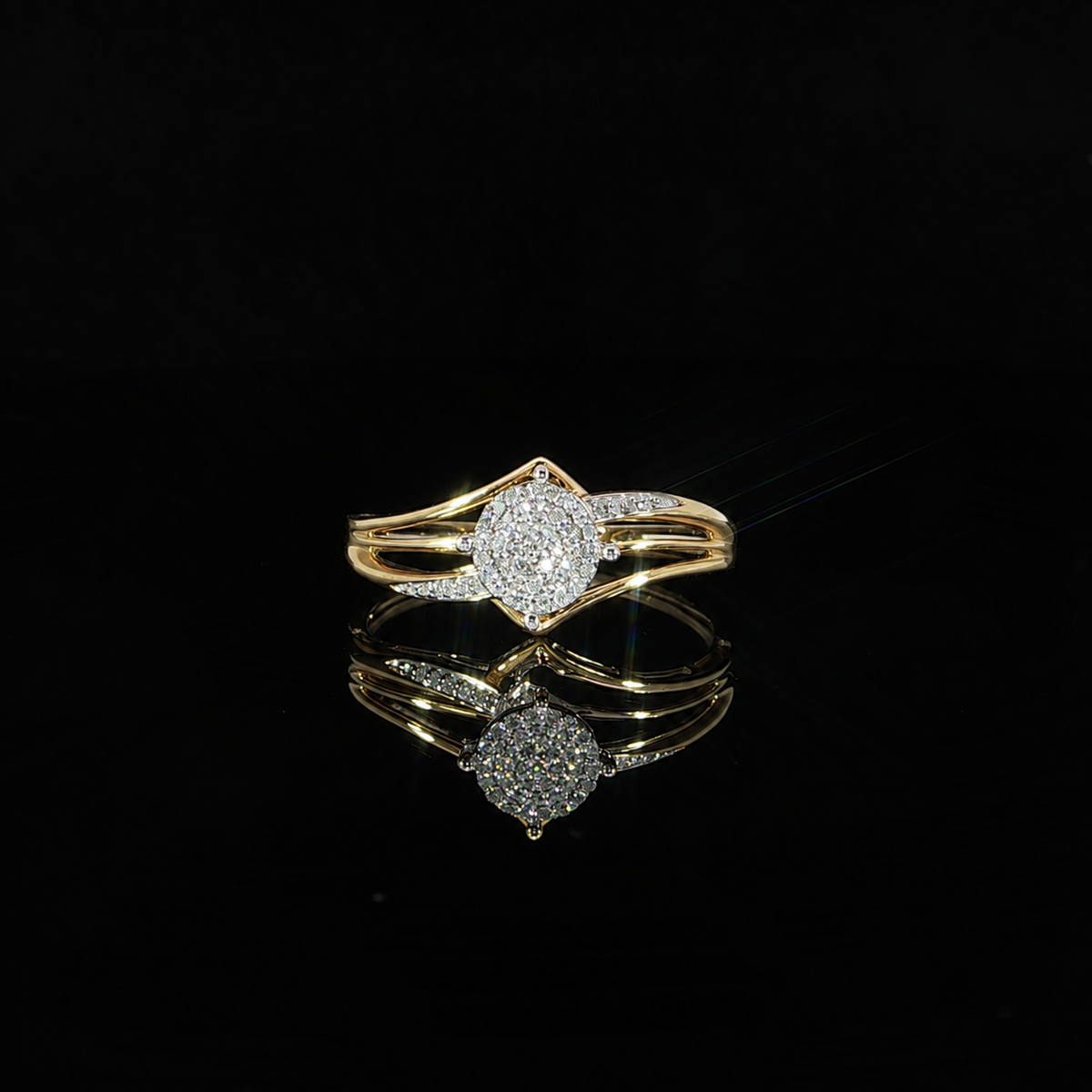 Front of 10K yellow gold 0.07 CTW round composite diamond ring with a raised setting and open shoulders.
