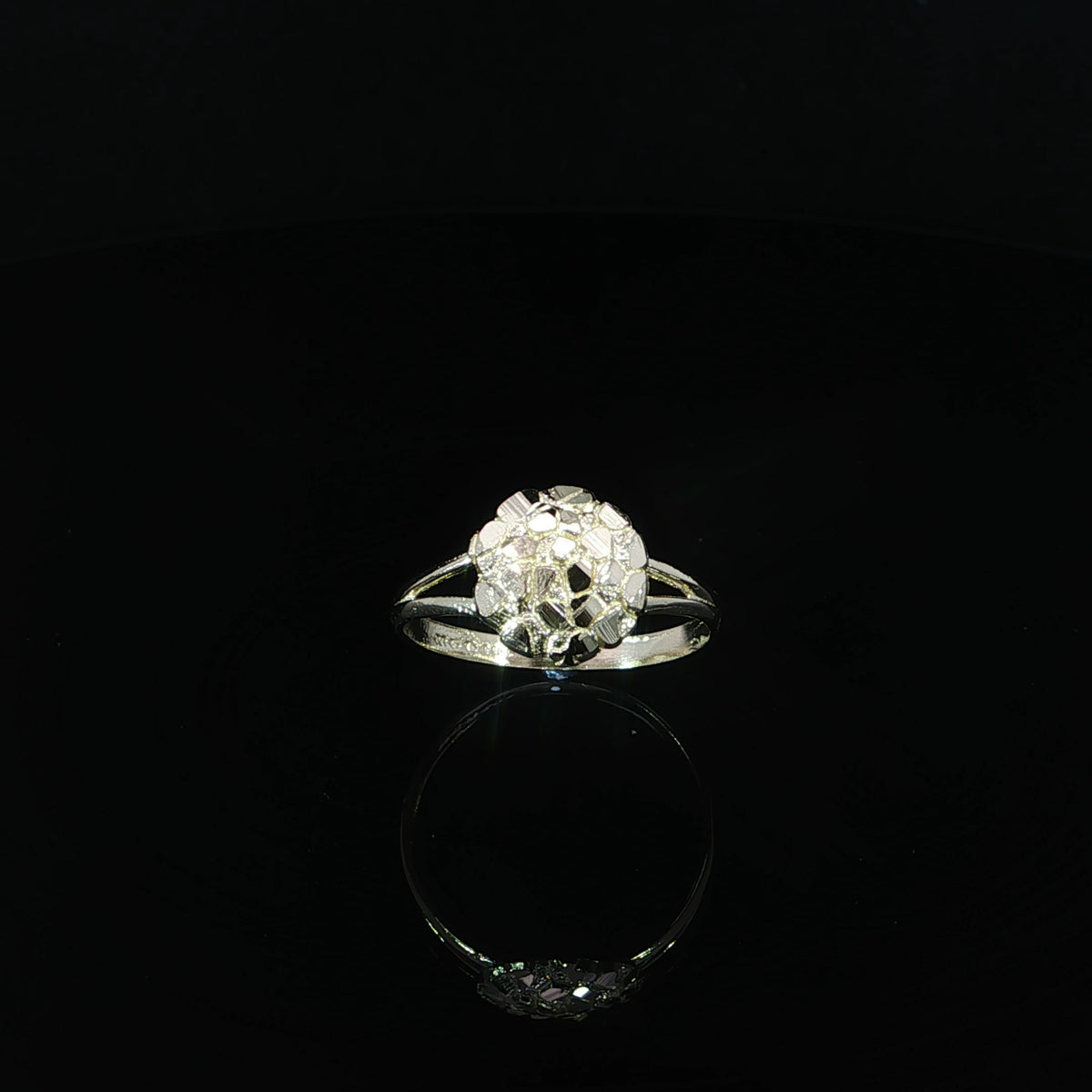 A 10mm circular nugget ring in yellow gold with a textured face and symmetrical split shank.