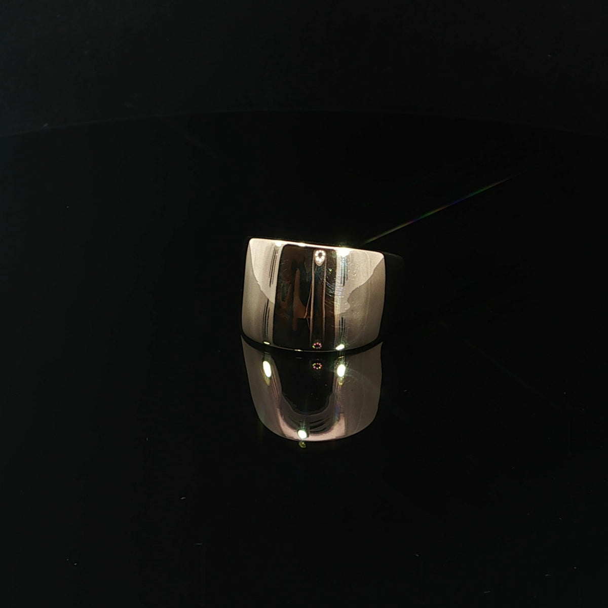 14K yellow gold dome ring showing its curved top and tapered band