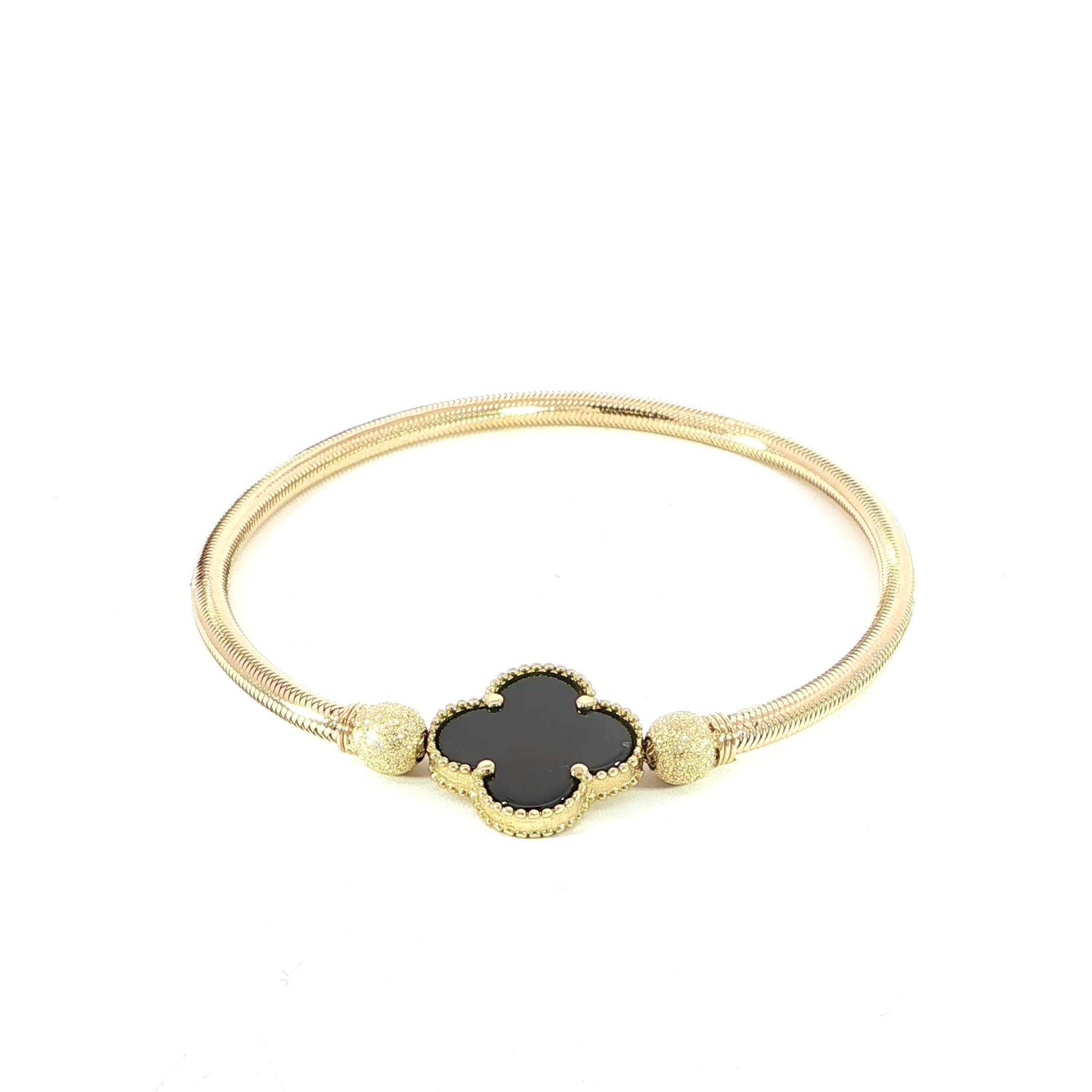 14K gold bracelet featuring a black onyx clover