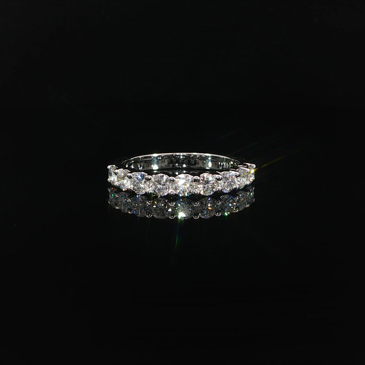 Front view of a 14K gold half-eternity band with round lab-grown diamonds in prong settings.
