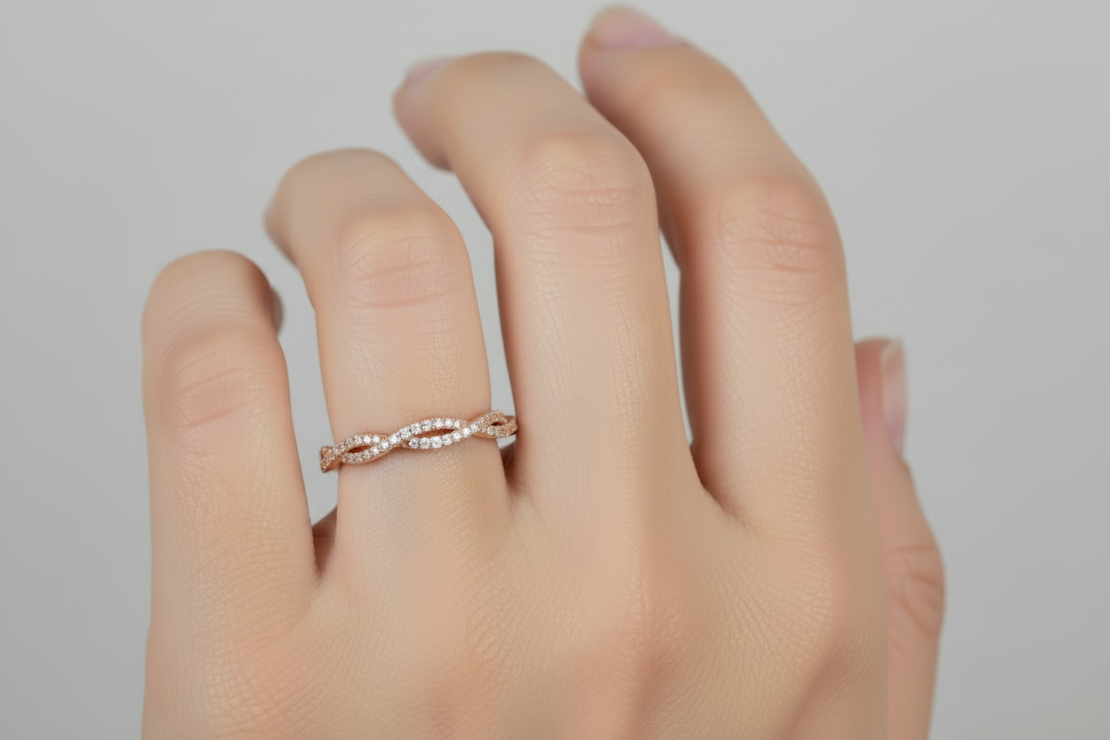 Model wearing 14K gold twist wedding band with 0.23 carat lab diamonds