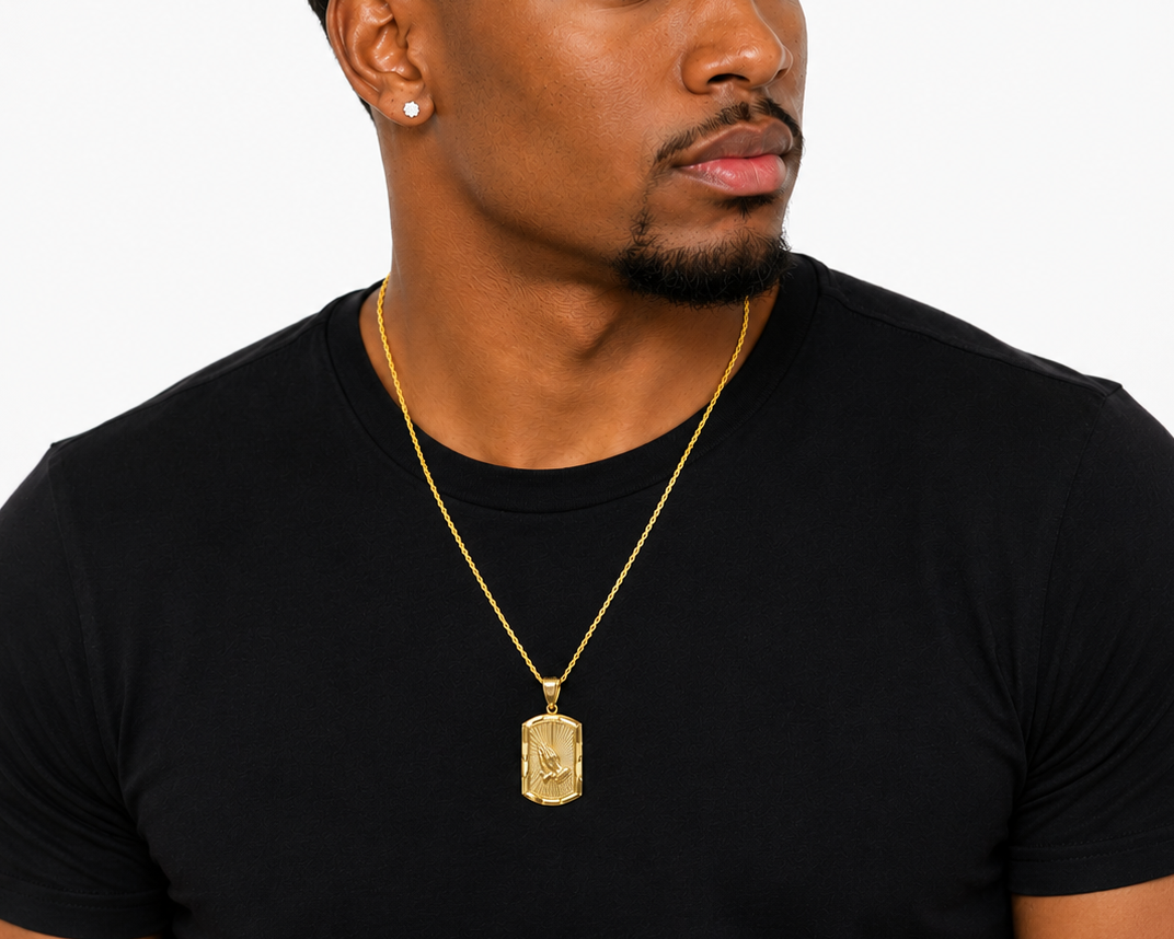 Religious Gold Pendant with Radiant Sunburst Background