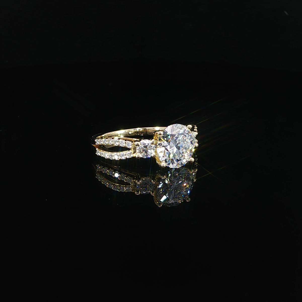 Side view of a 14K gold diamond ring showing the split band and raised center setting