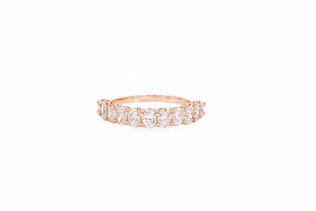 Close up of 14K rose gold oval diamond half eternity band
