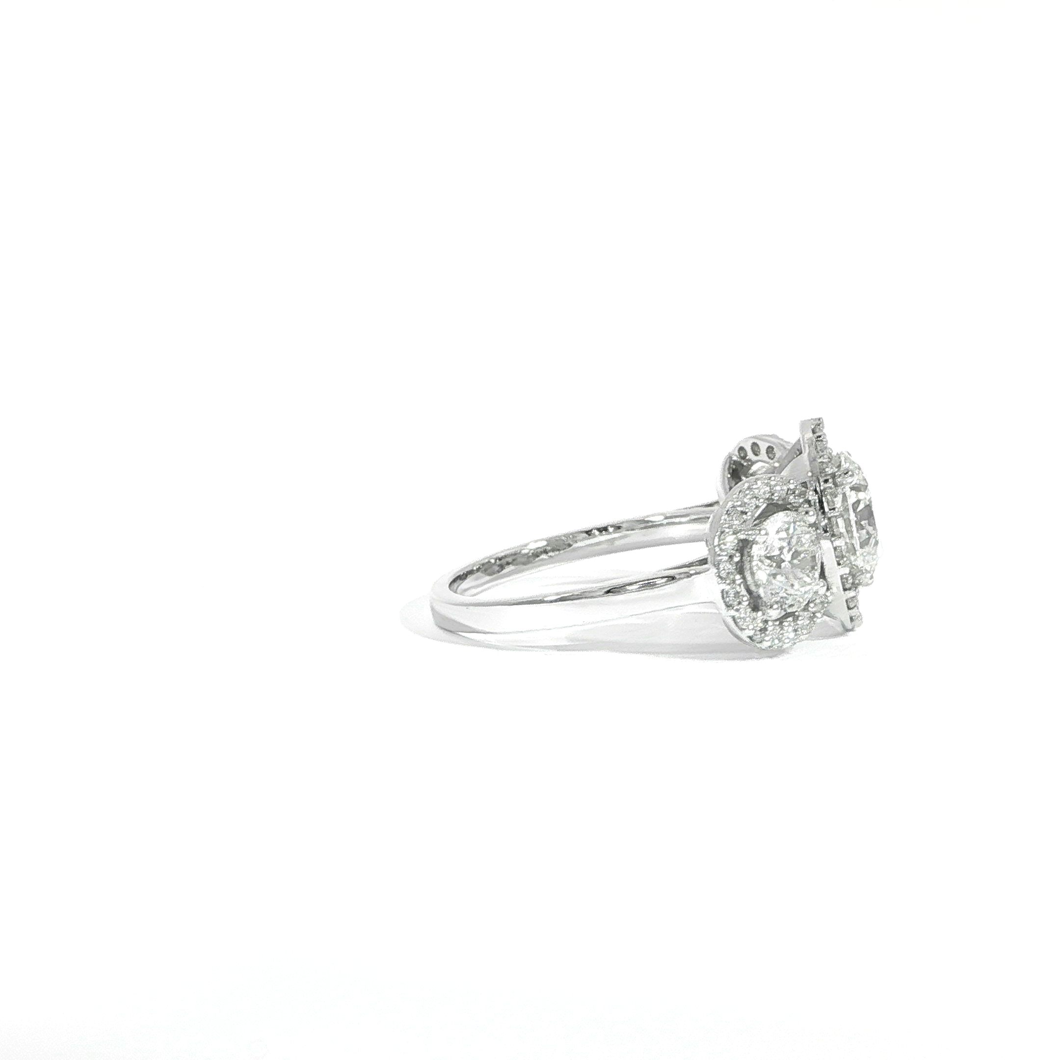Side detail of white gold engagement ring round cut diamonds and halo