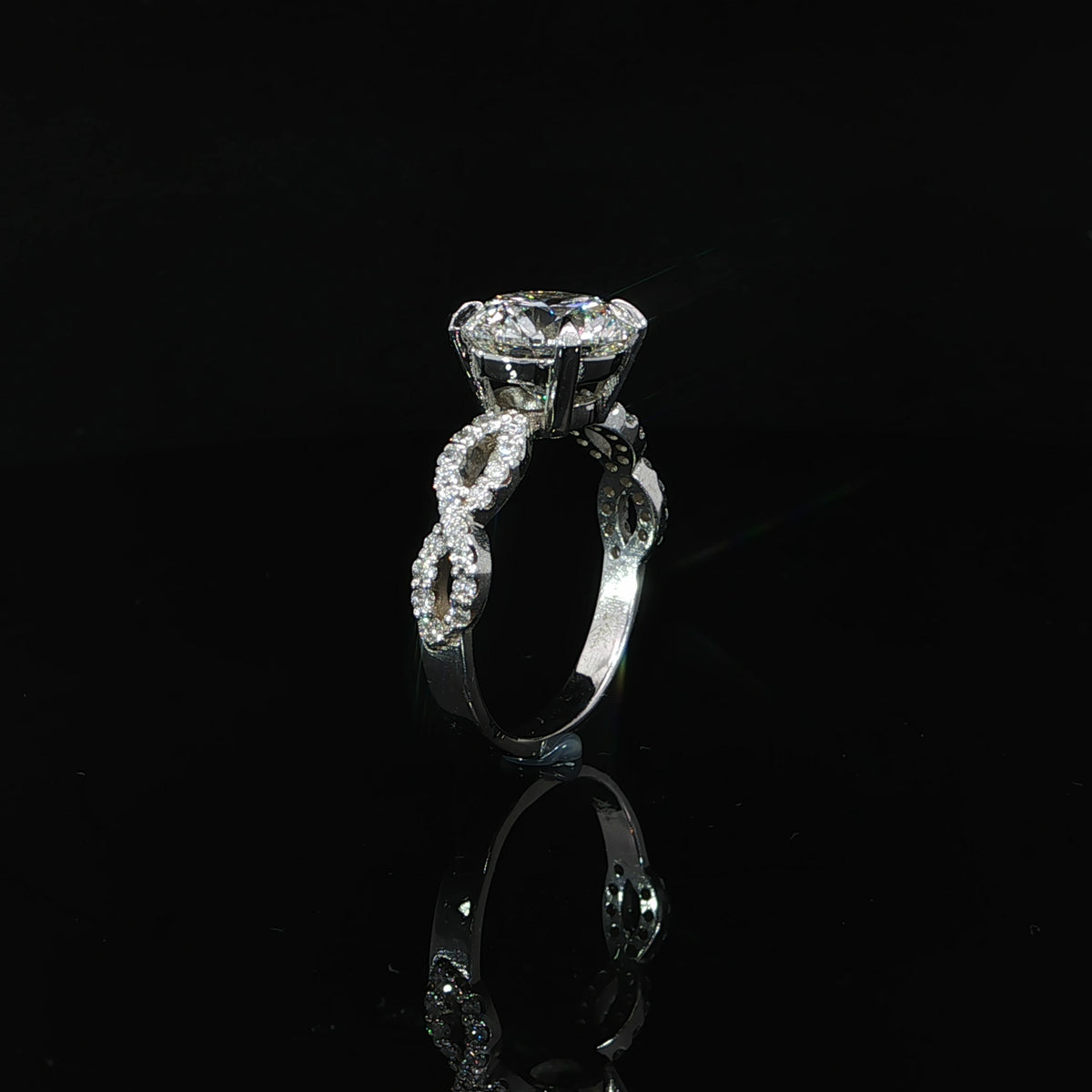 Standing view of a 14K white gold 3.37 CTW lab-grown diamond ring showing the twist shoulders and polished lower band.