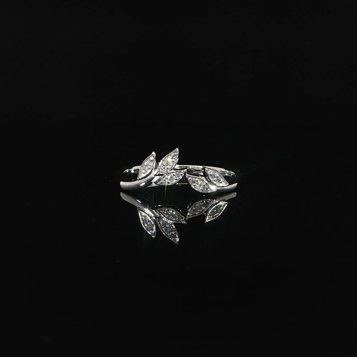 14K white gold curved diamond leaf ring featuring 0.06 CTW lab grown diamonds arranged in a delicate botanical-inspired design.