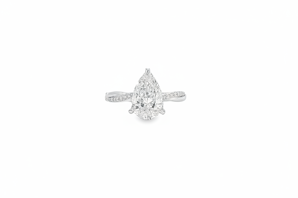 14K white gold pear diamond ring with halo detail and modern twist band