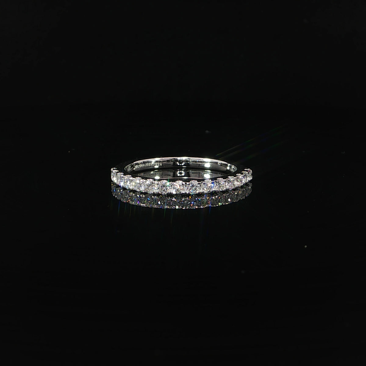 Front view of a 14K white gold band with a single row of round lab-grown diamonds.