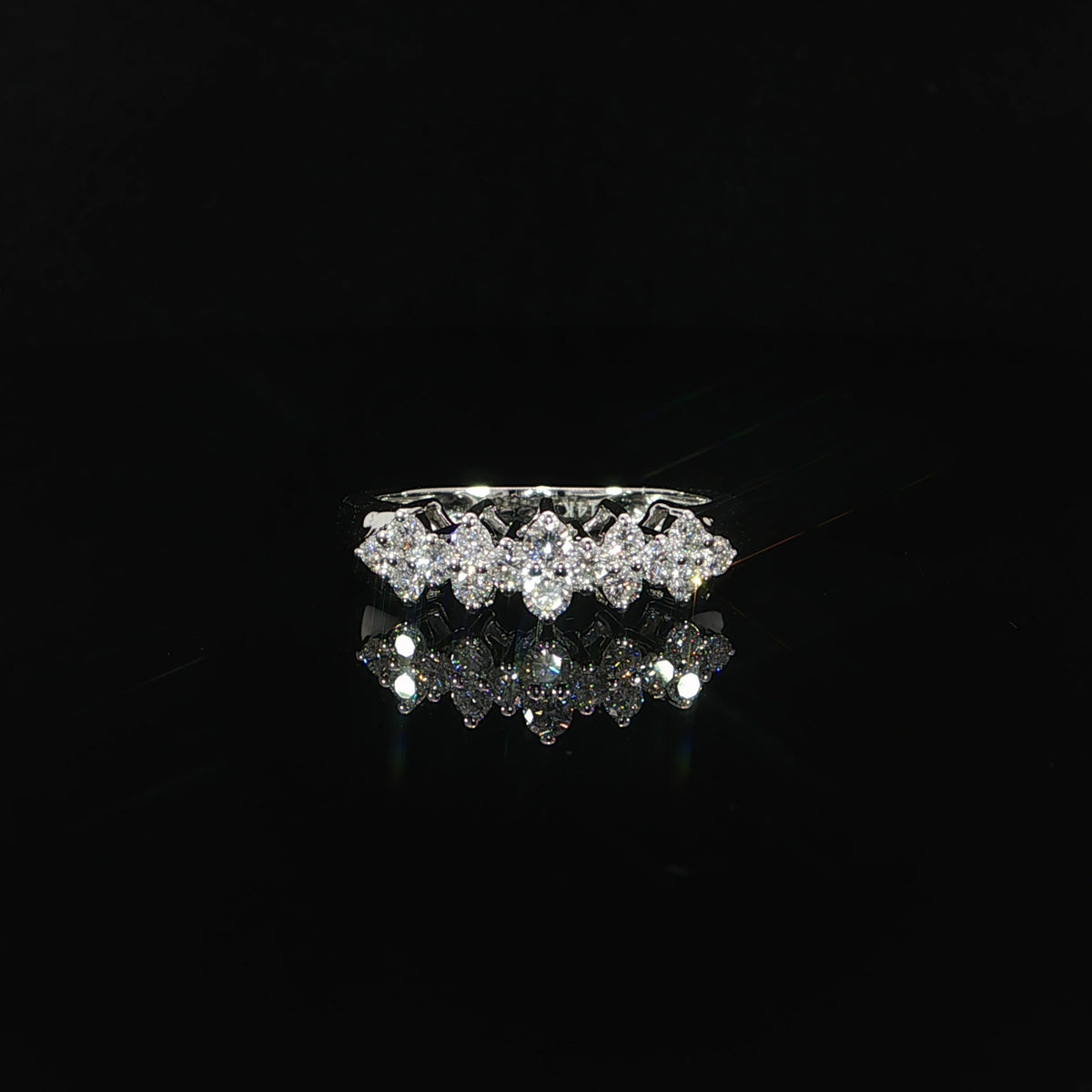Front view of a 14K white gold ring with round lab-grown diamonds arranged in repeating clusters.