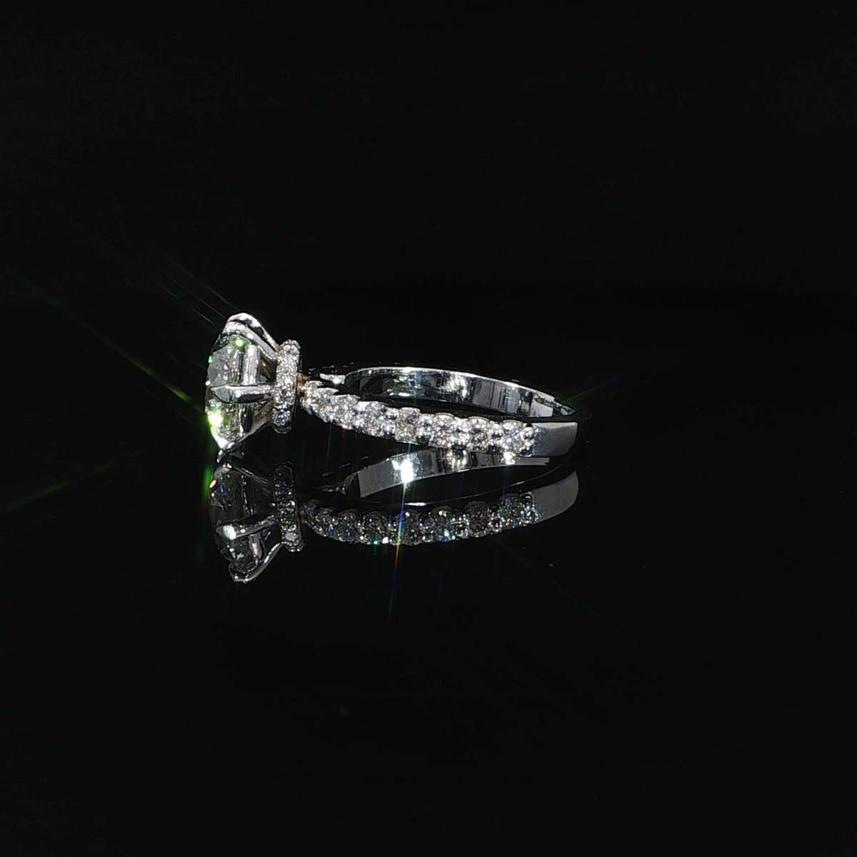 Angled view of 14K white gold split-shank diamond engagement ring