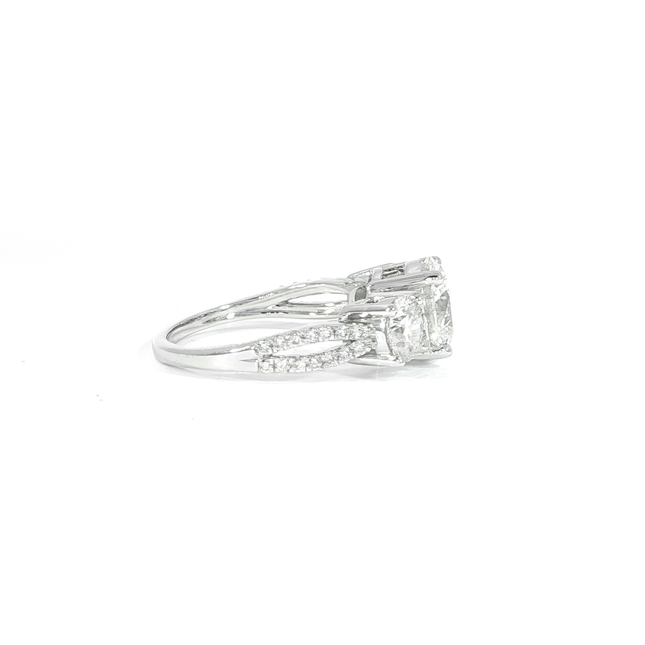 Side view of split shank diamond ring with three stone setting