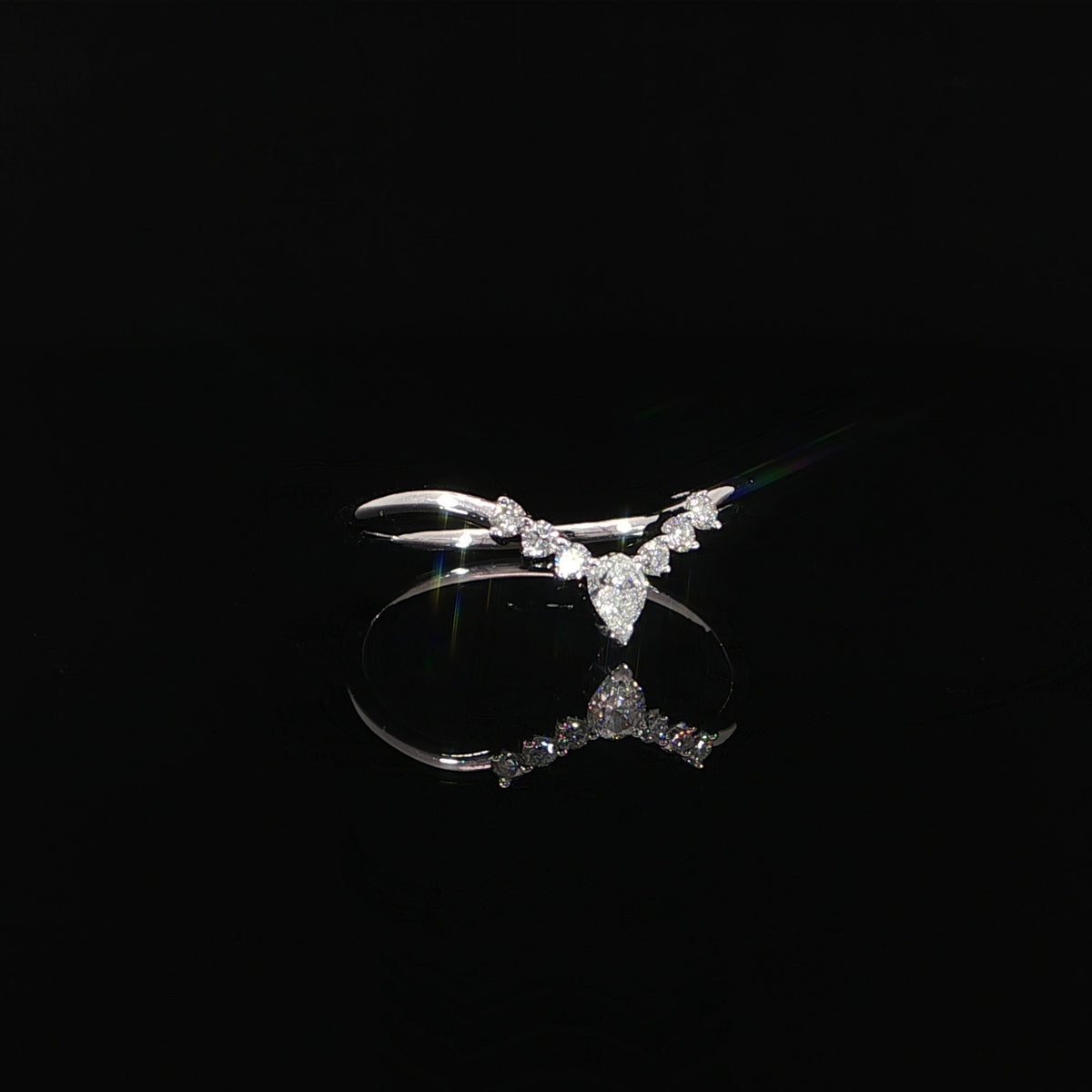 14K white gold stackable V-shaped diamond band featuring 0.18 CTW lab grown diamonds with a delicate pear-shaped center cluster.