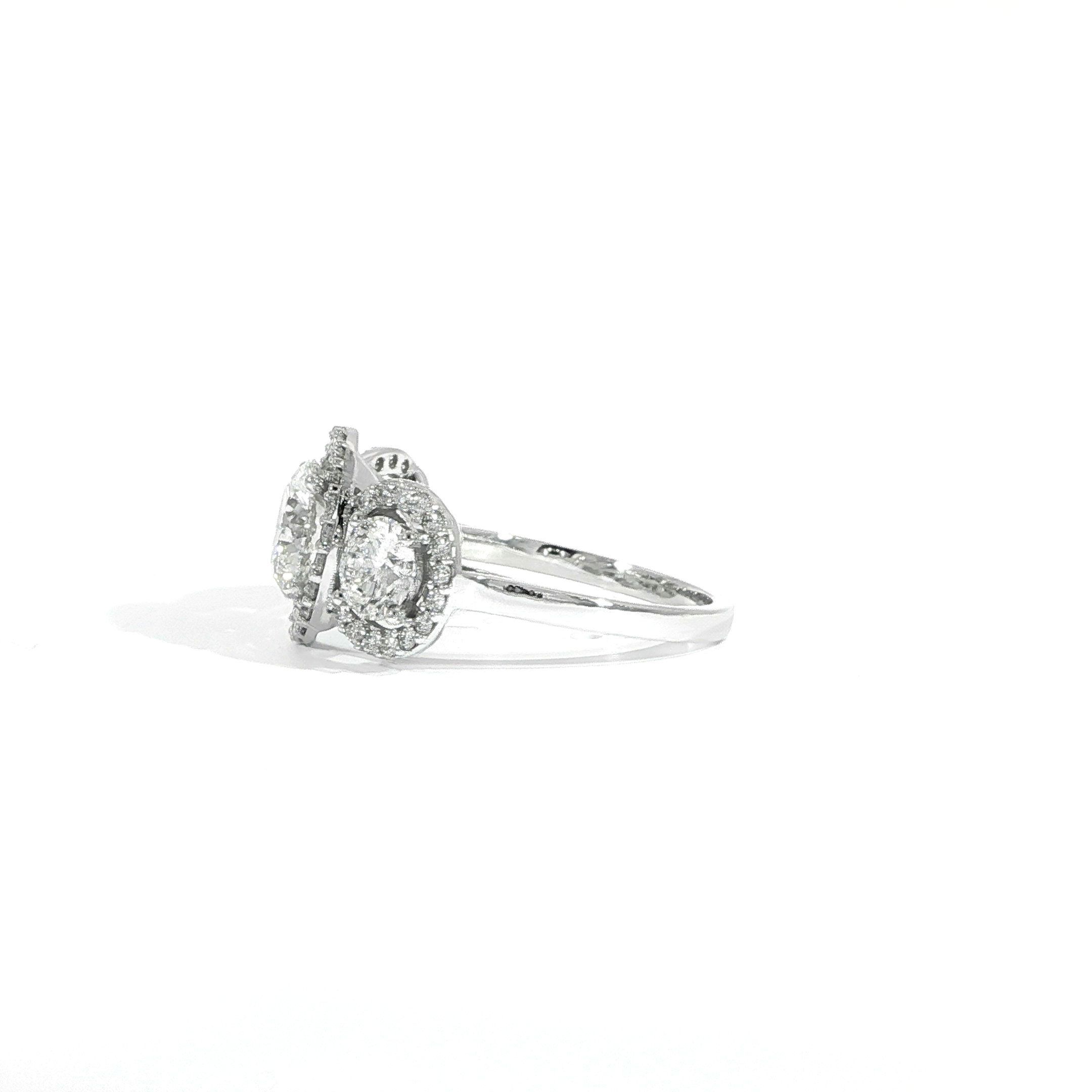 Luxury three stone diamond engagement ring with halo design side view