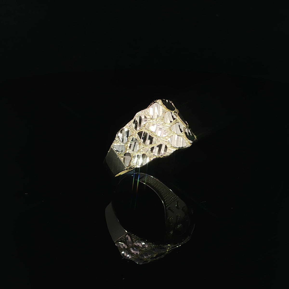 Three-quarter side view of a 14K yellow gold nugget ring highlighting the textured 14mm top, raised oval-shaped facets, and smooth tapered shank.