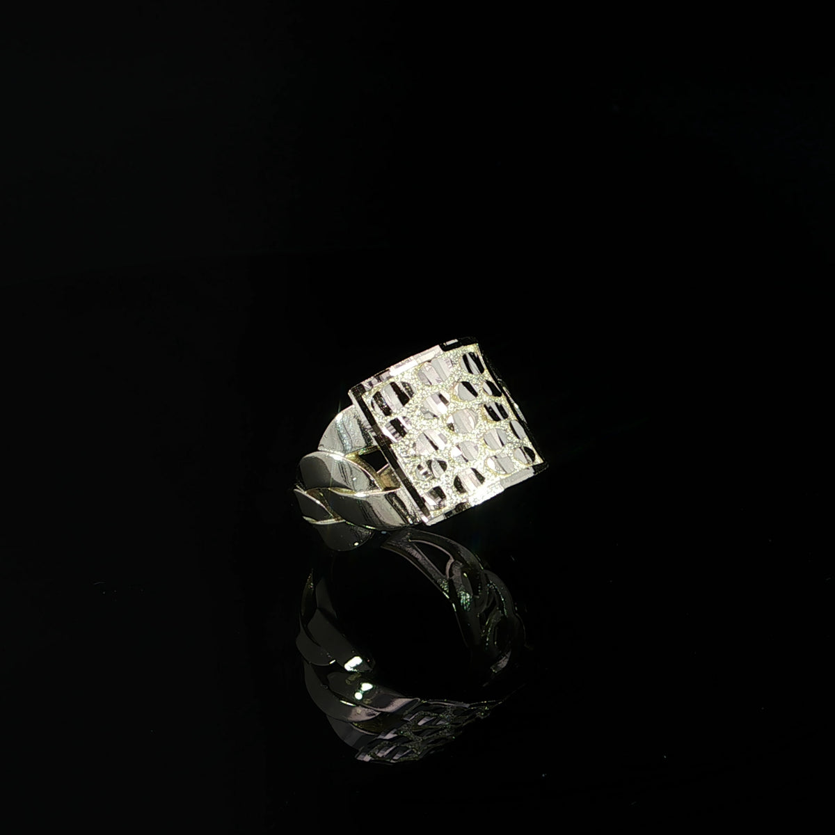 Tilted profile of a 15 mm nugget ring showing its textured face and open link-style band.