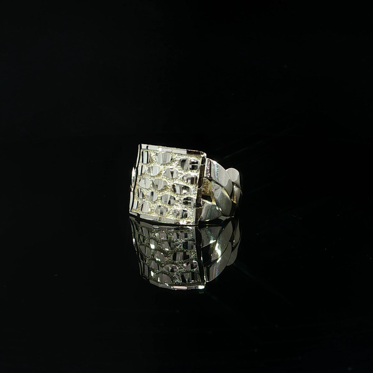 15 mm yellow gold nugget ring shown from the front with a reflection on black