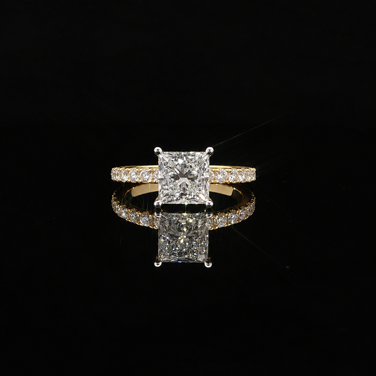 Princess cut engagement ring with sparkling pave-set diamond band in polished 14K yellow gold.