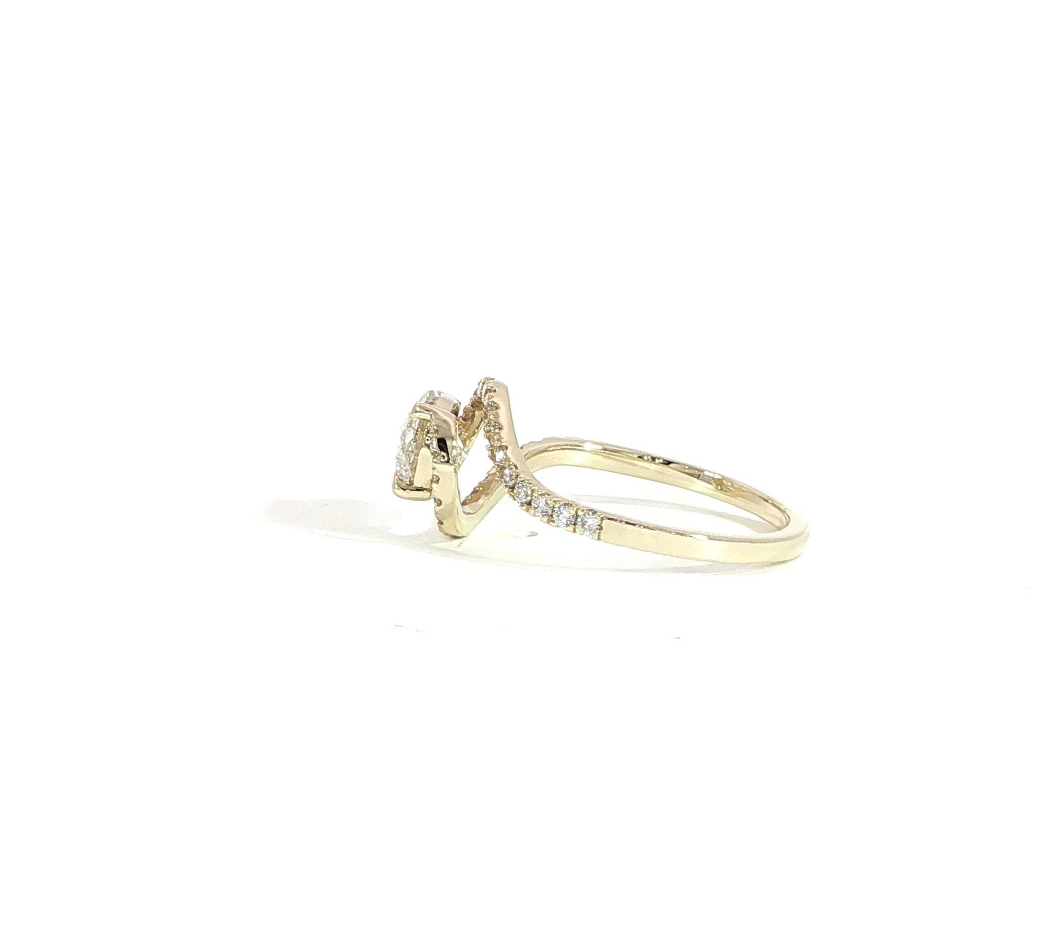 Side view of round diamond engagement ring with bypass design