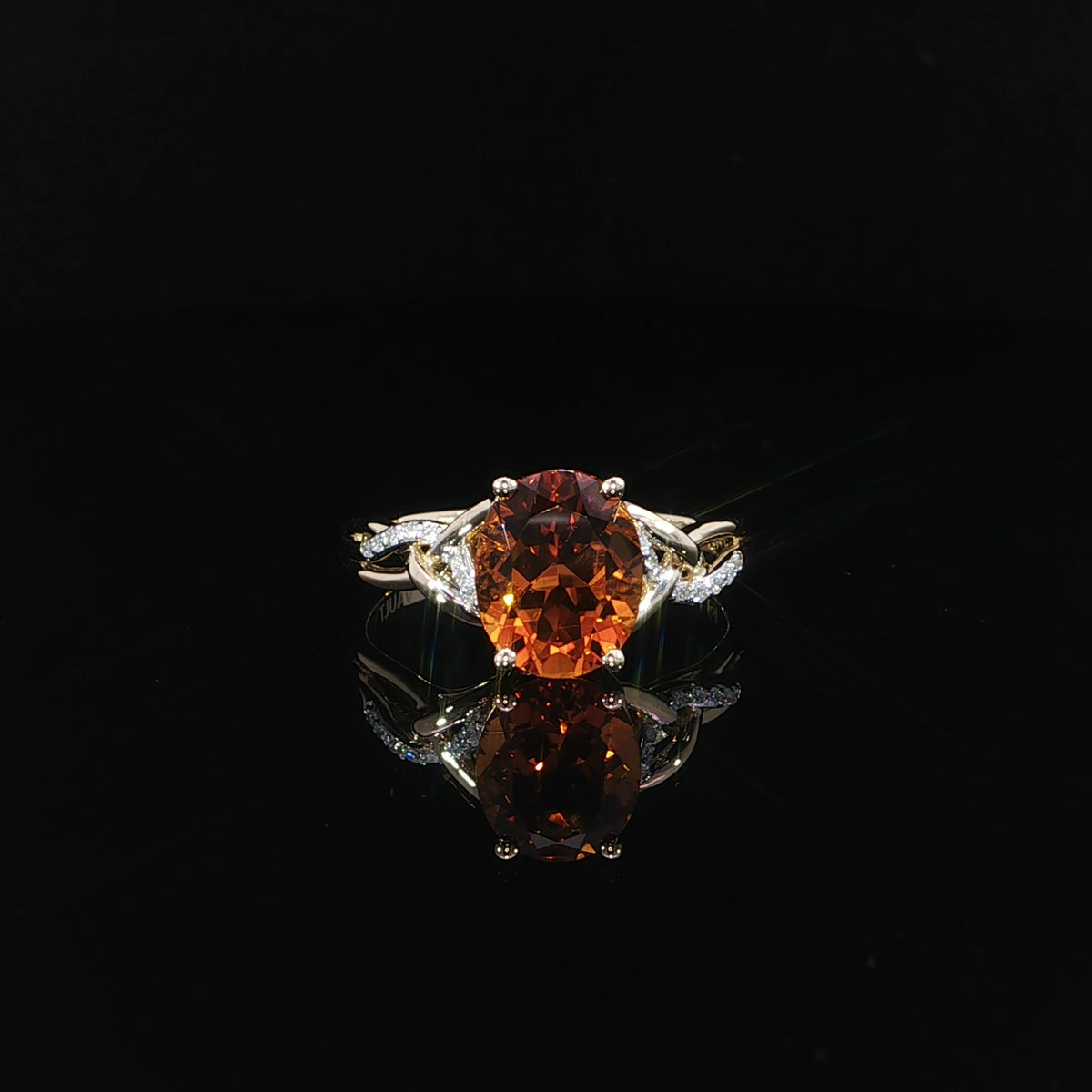 14K yellow gold ring with a 10x8 mm oval natural citrine and 0.06 CTW diamond twist band, front view.