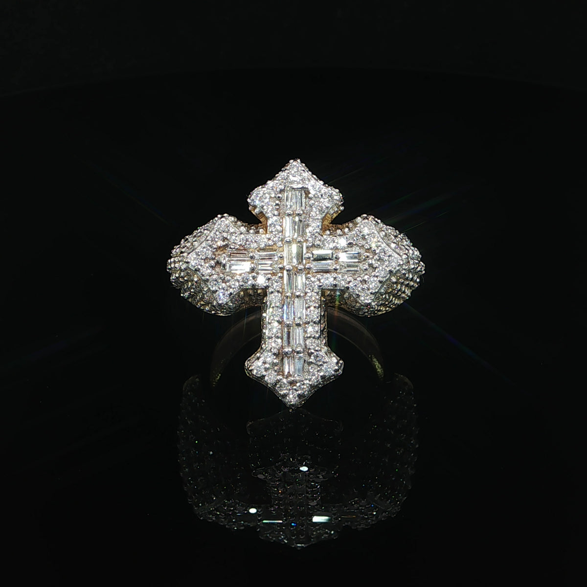 Front view of a 14K yellow gold cross ring with baguette and round natural diamonds.