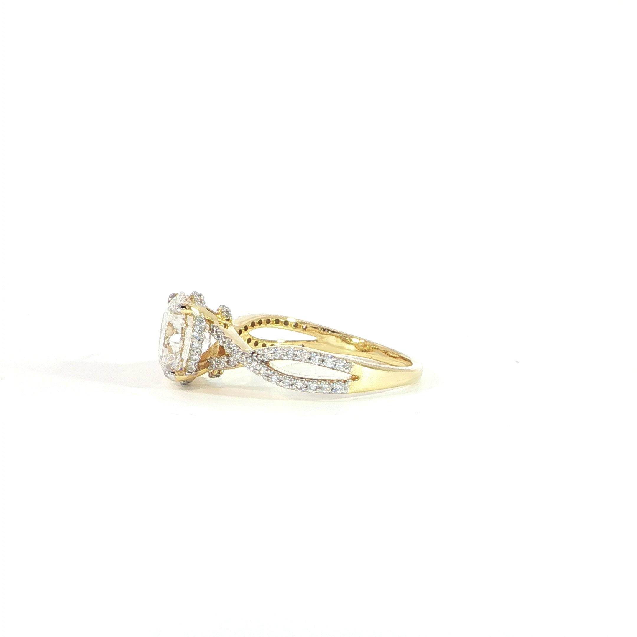 Side view of 14K gold round engagement ring with twisted band design