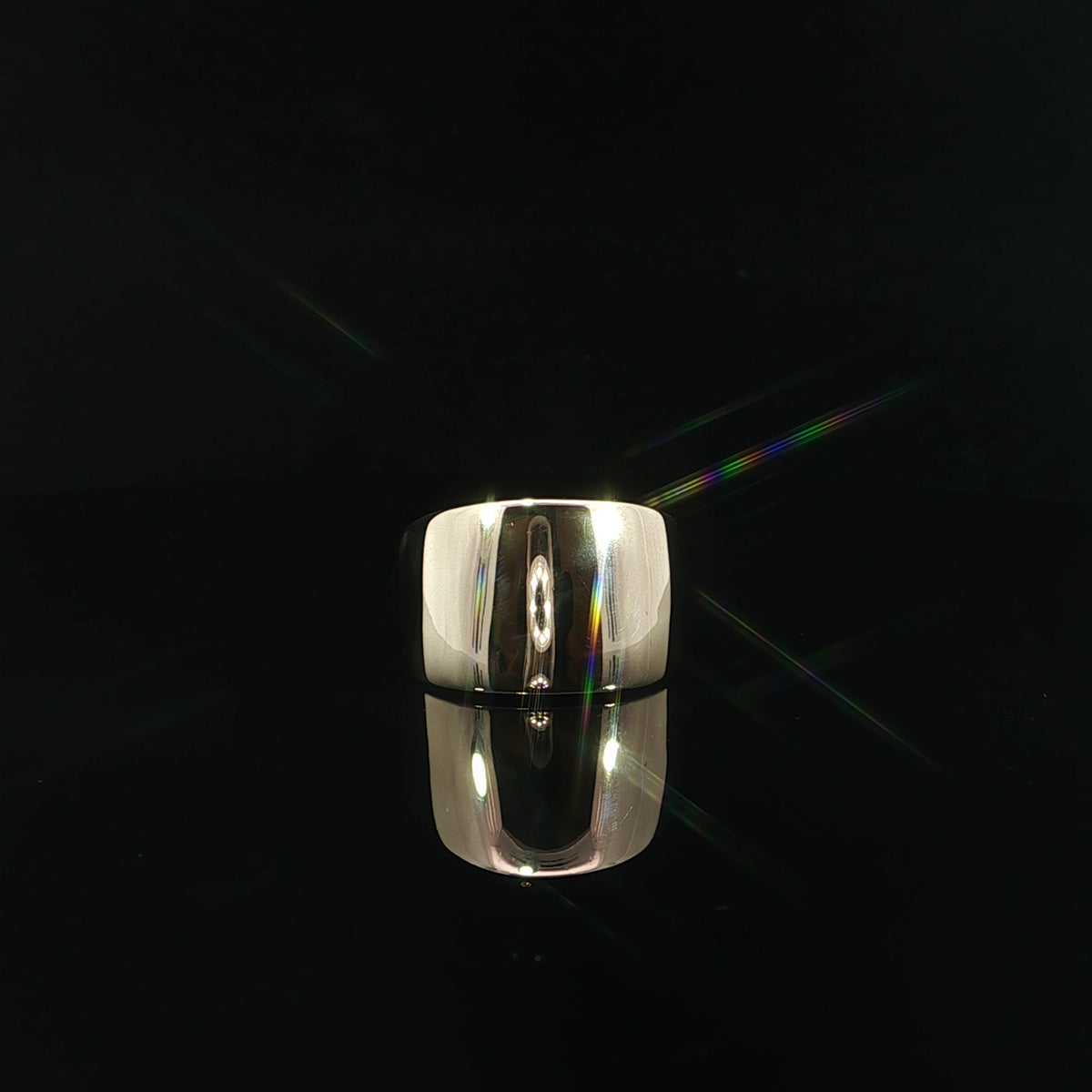 Front view of a 14K yellow gold high polish dome ring with a 13mm top