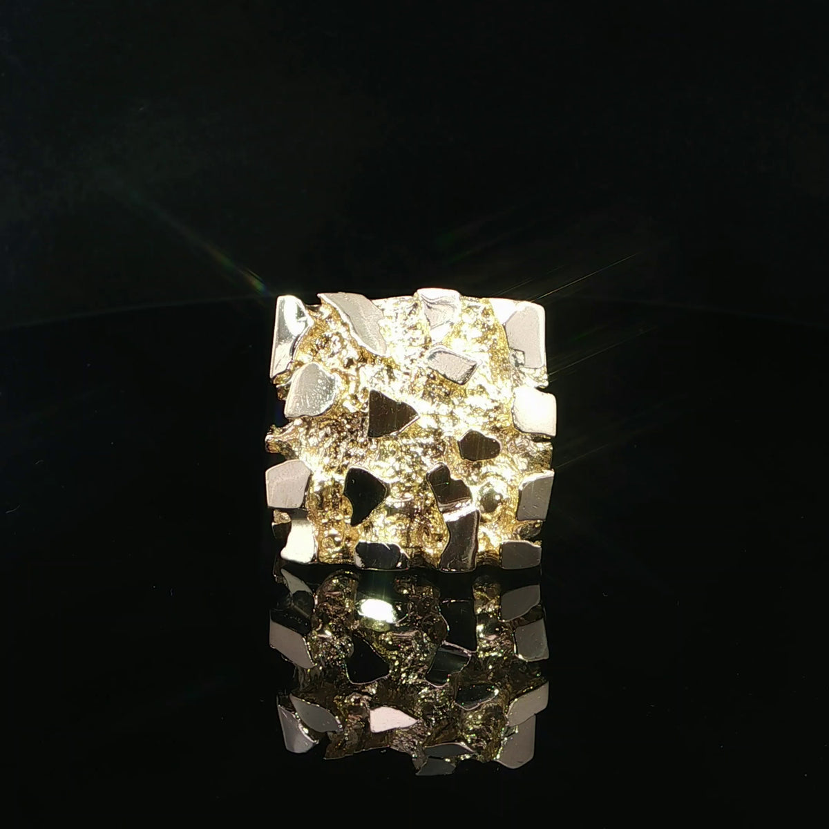 Large 14K yellow gold nugget ring with raised polished facets and a rugged textured surface.