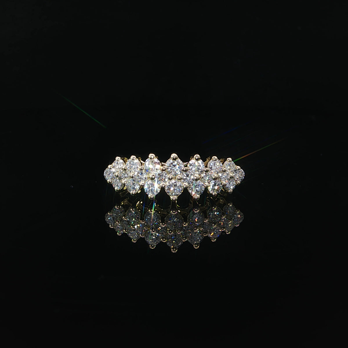 Front view of a 14K yellow gold anniversary band with staggered rows of lab-grown diamonds.