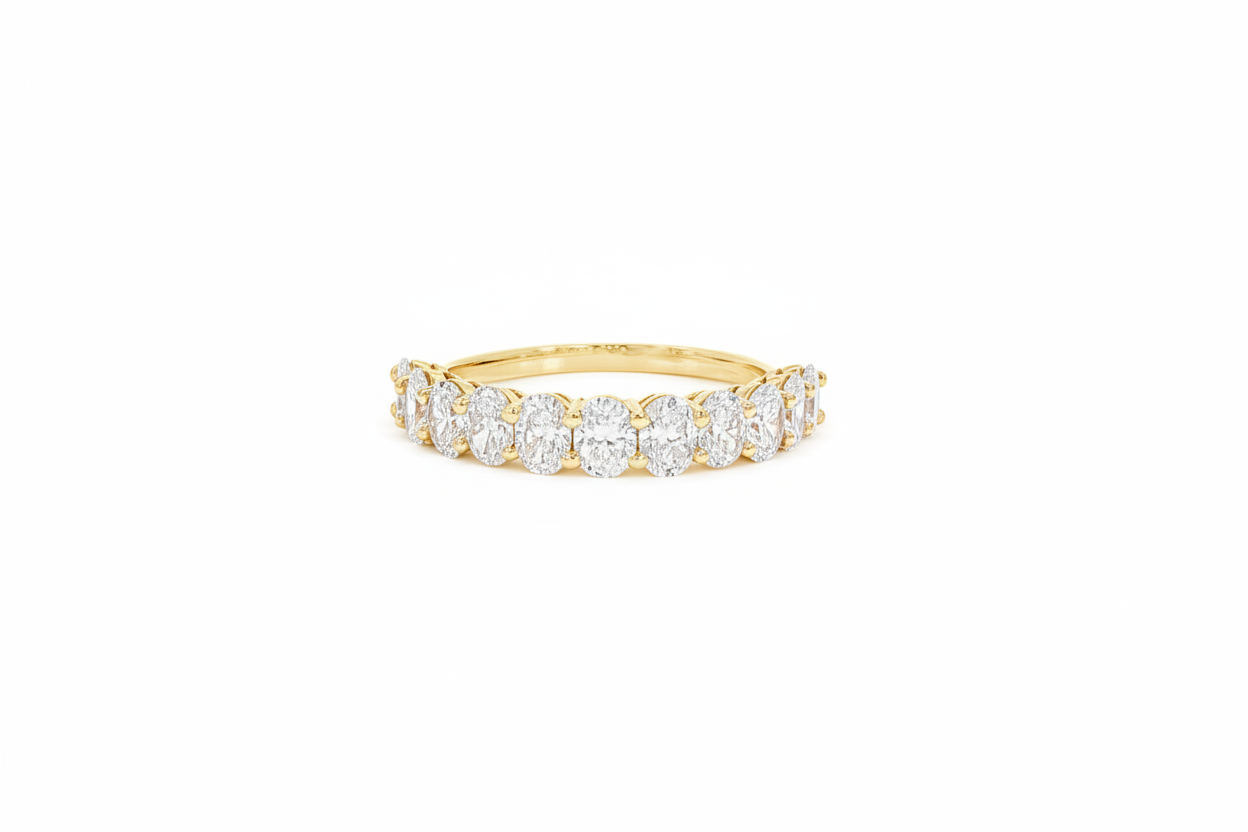 Close-up of oval lab-grown diamond eternity band in 14K yellow gold