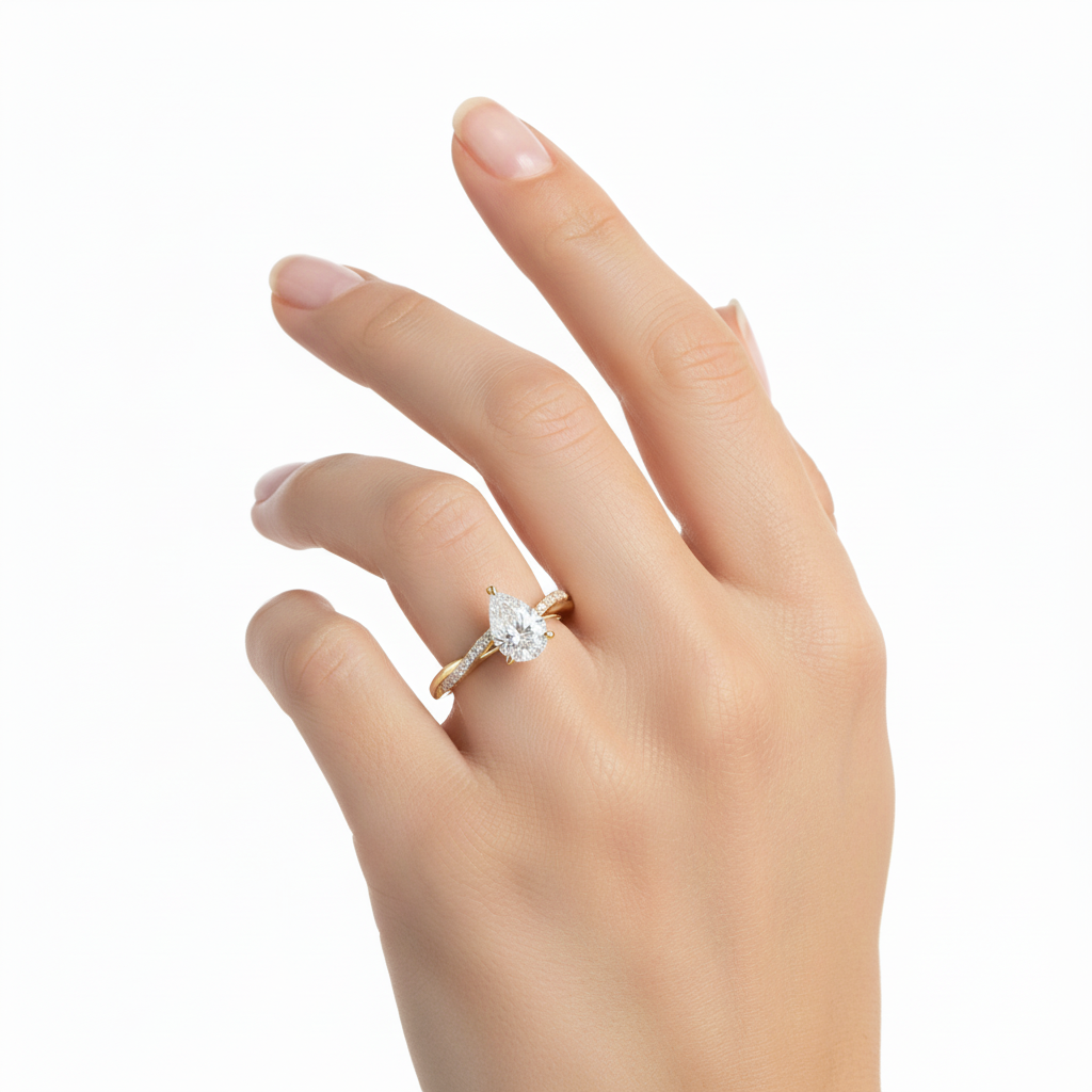 Close-up of pear shaped diamond ring with hidden halo and twisted band