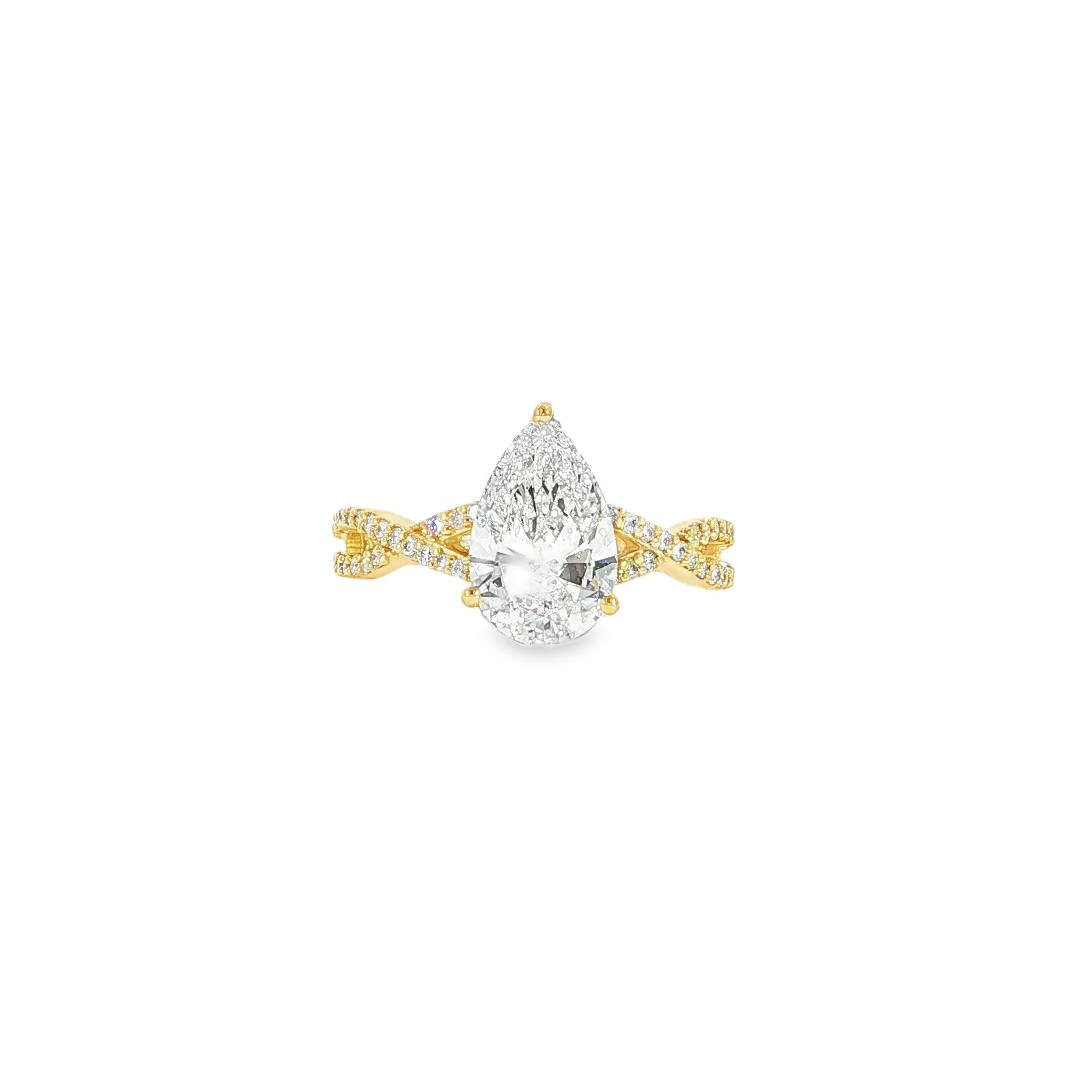Close up of 14K gold pear diamond engagement ring with 2CT center, twist band and hidden halo