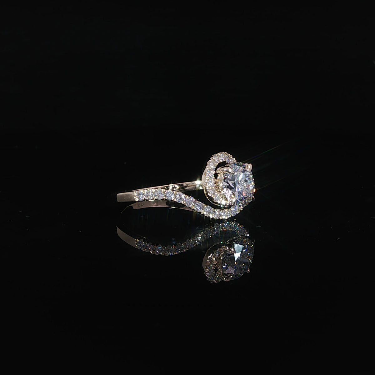 Side profile of yellow gold round diamond engagement ring with flowing pavé bypass band