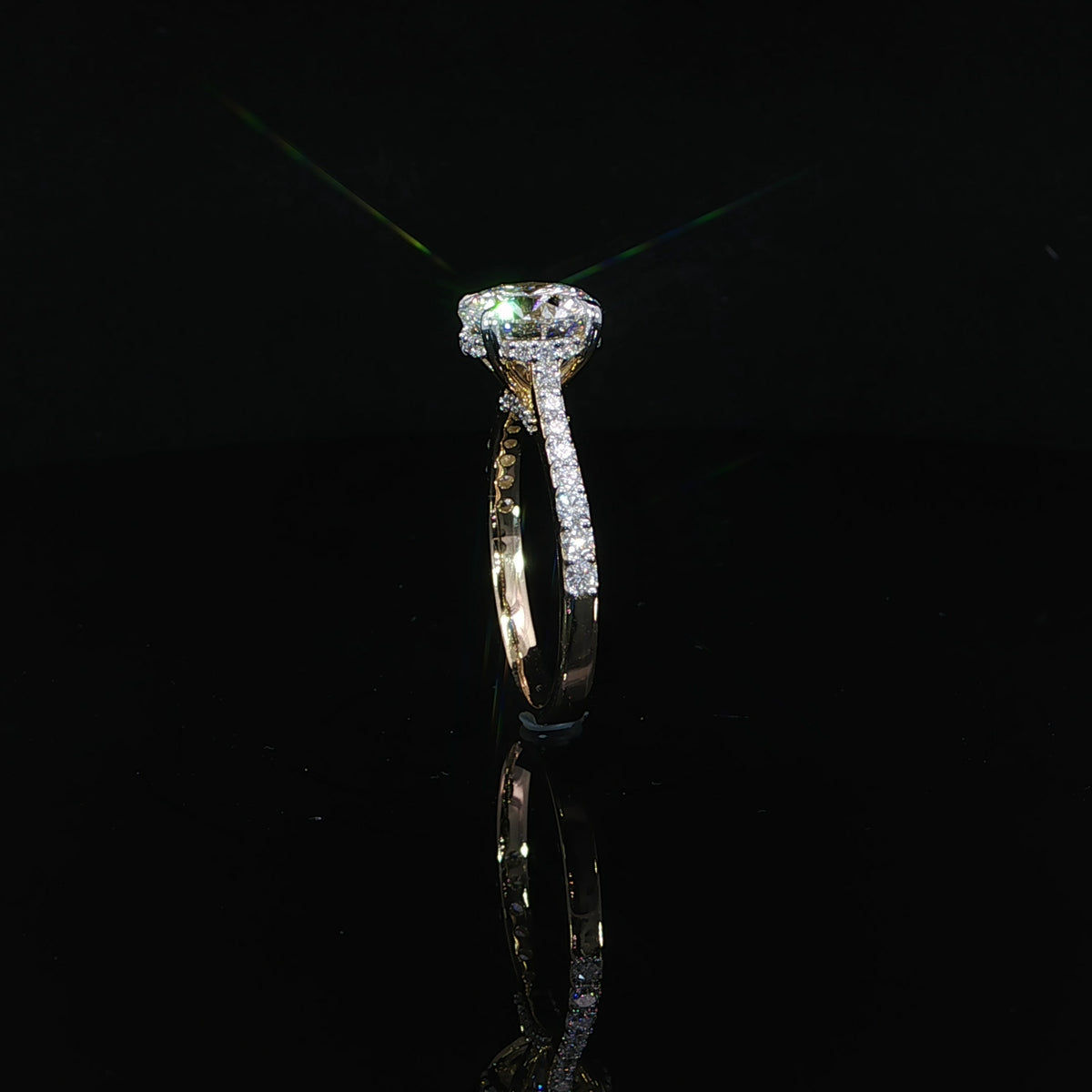 Detailed view of the hidden diamond halo beneath the 2-carat round center stone.