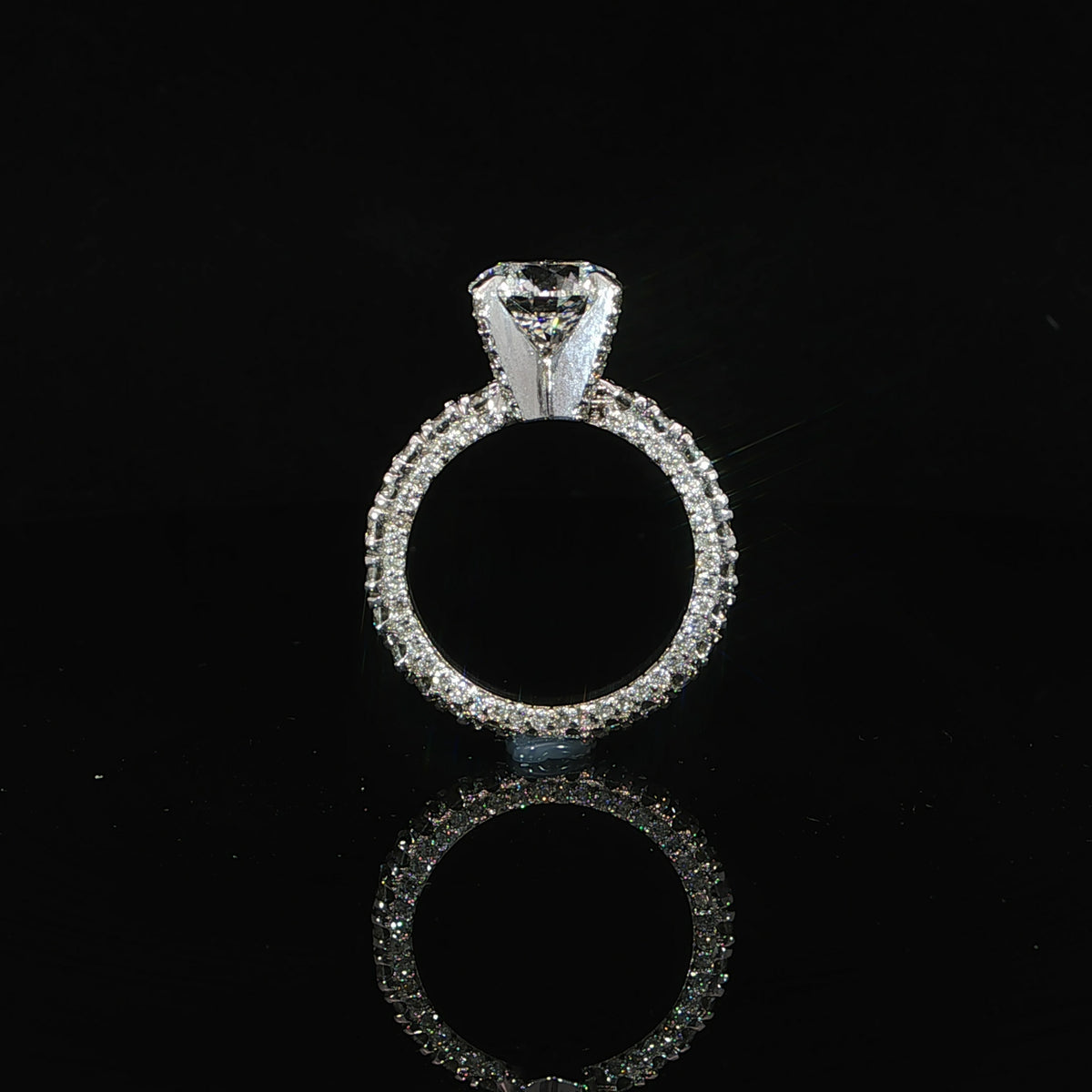 Close-up of the diamond eternity band in 18K white gold