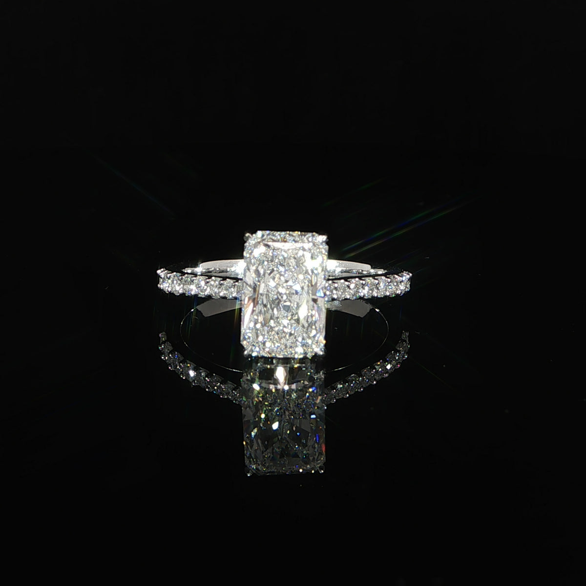 Radiant-cut lab-grown diamond engagement ring crafted in polished 14K white gold.