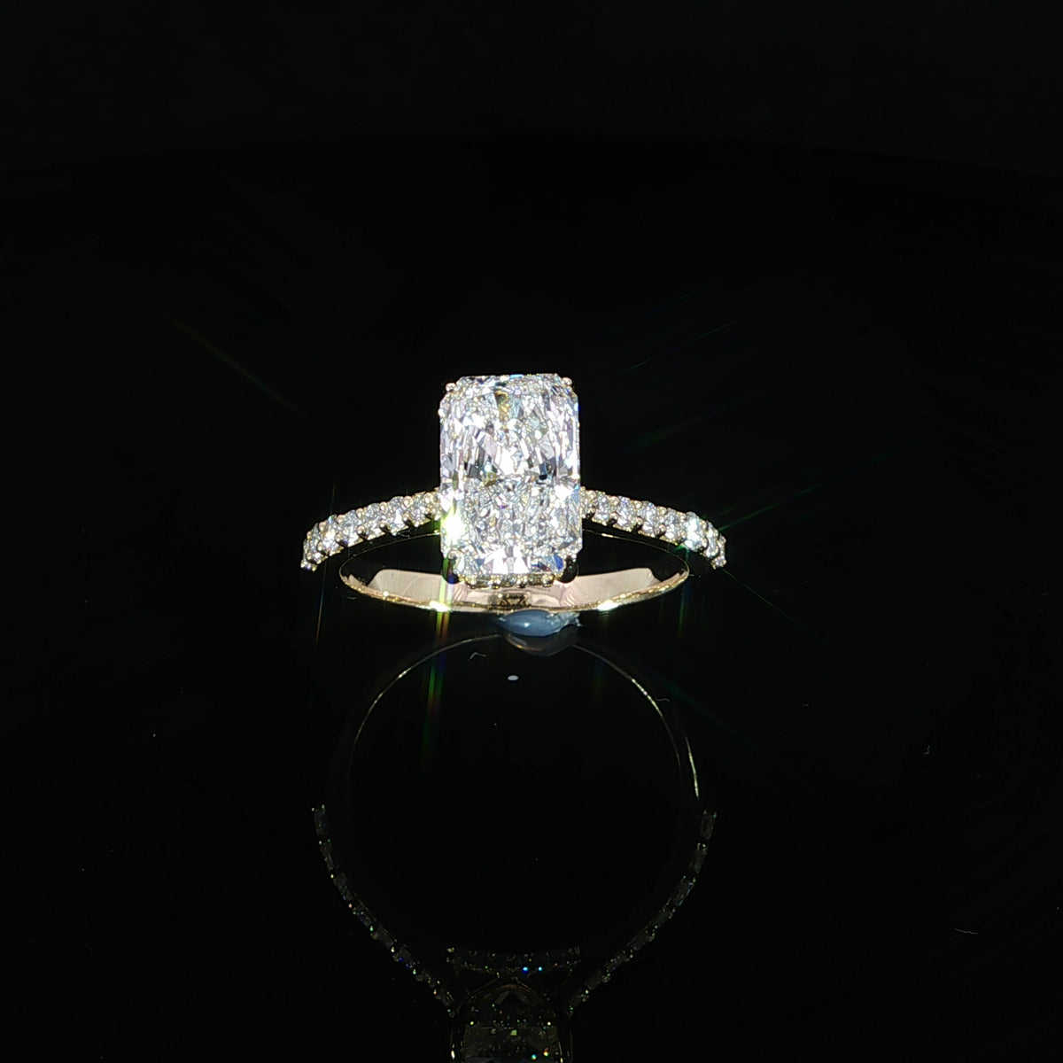 Angled view14k yellow gold radiant diamond engagement ring with 2.51 CTW