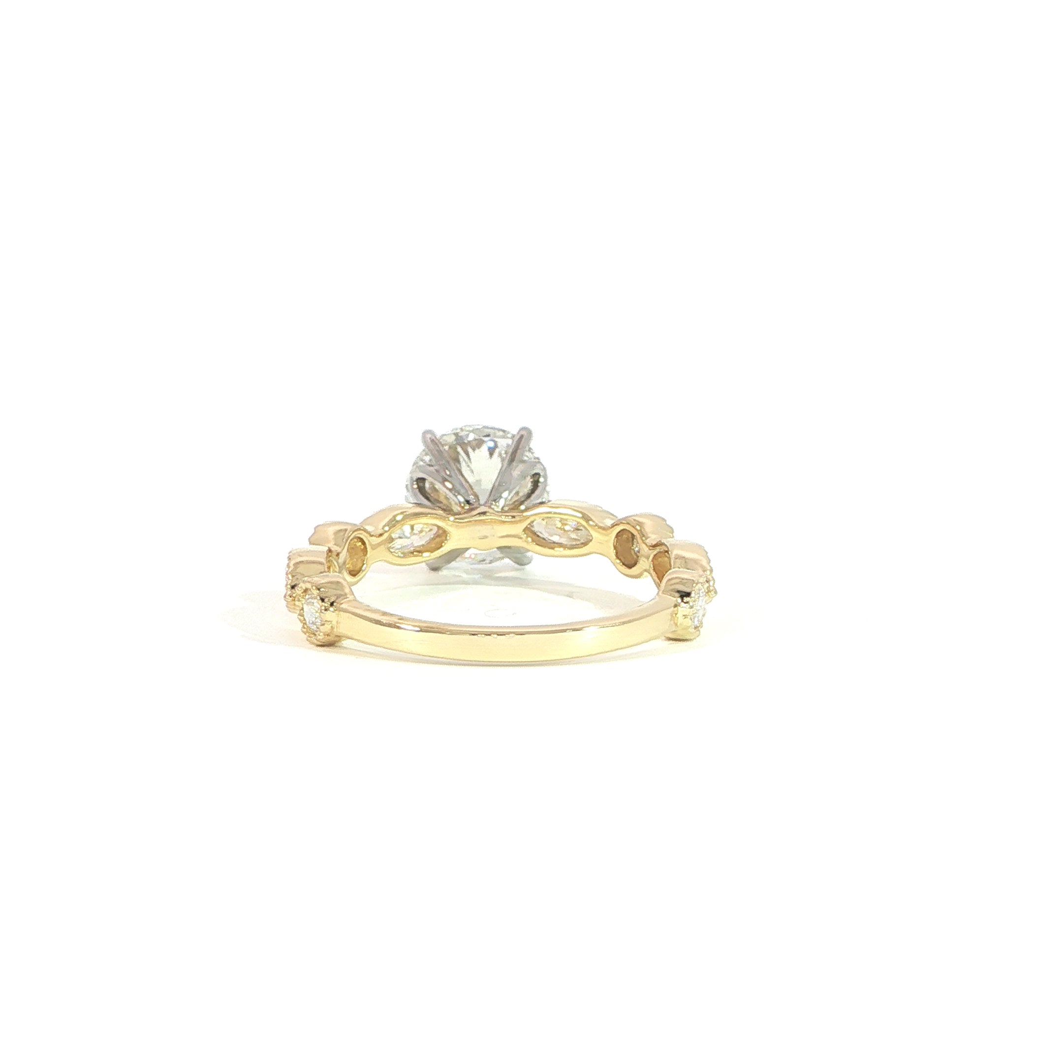 Back view 14K gold engagement ring with round diamond and accent stones