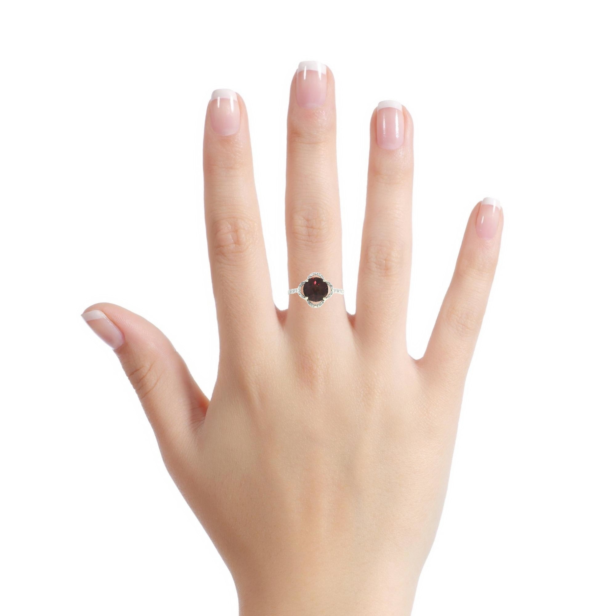 Model wearing 14K yellow gold garnet diamond halo ring