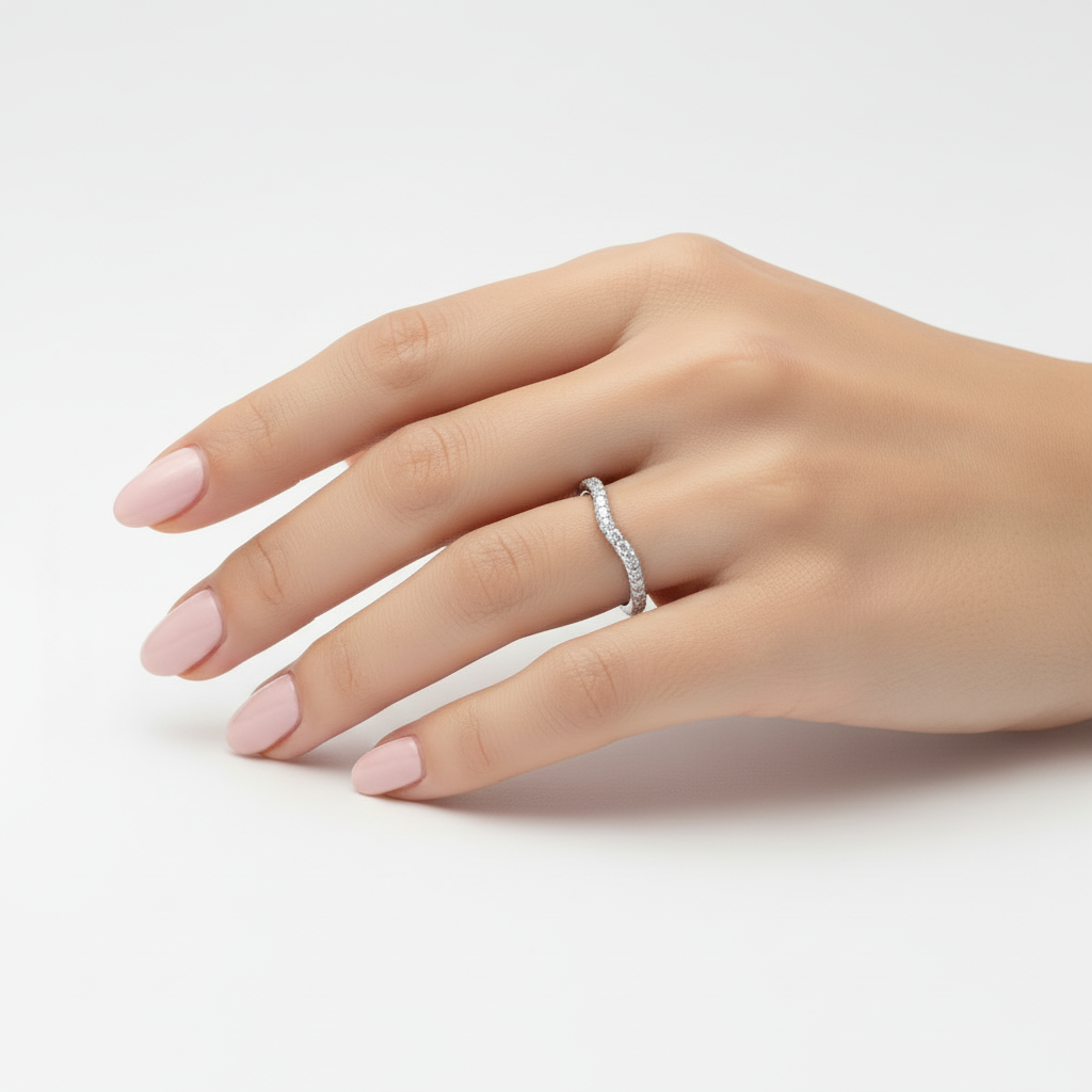 Model wearing curved diamond contour band in 14K white gold