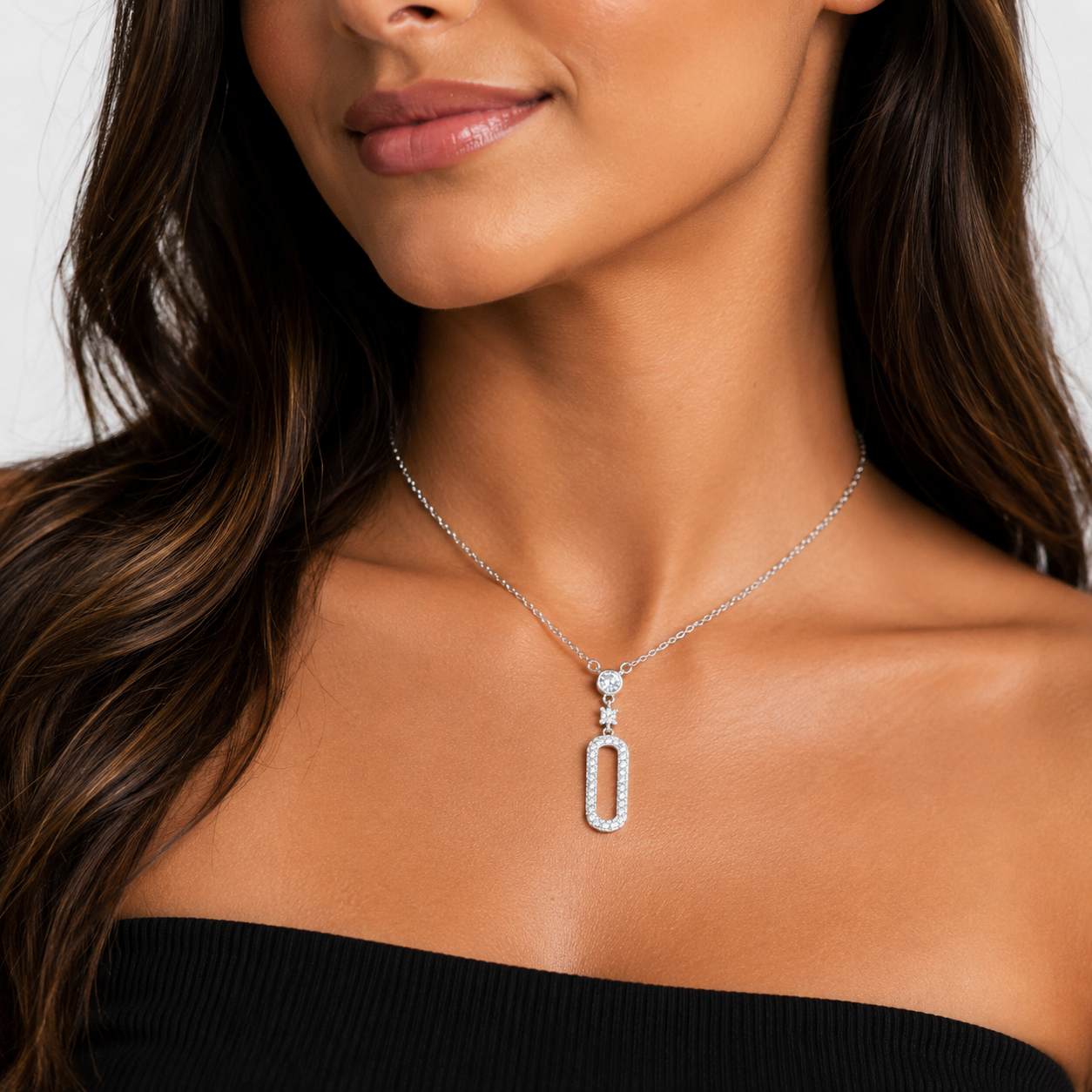 Elegant sterling silver necklace with paperclip-inspired design.