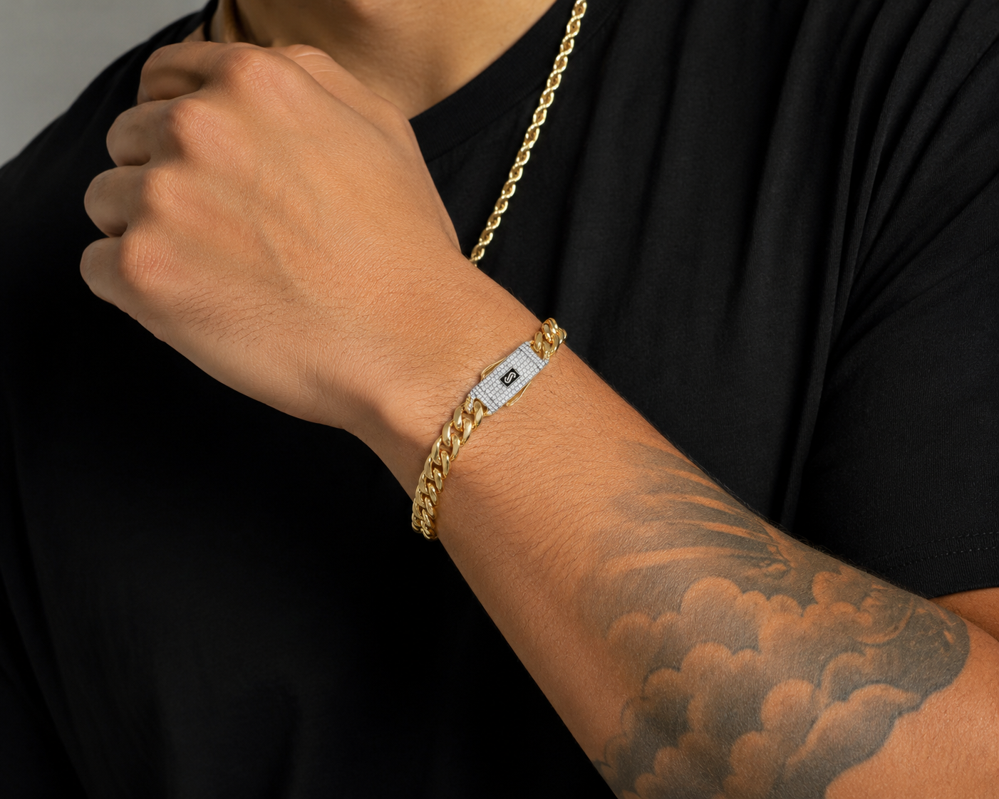 Polished gold Miami Cuban bracelet featuring CZ-set box lock