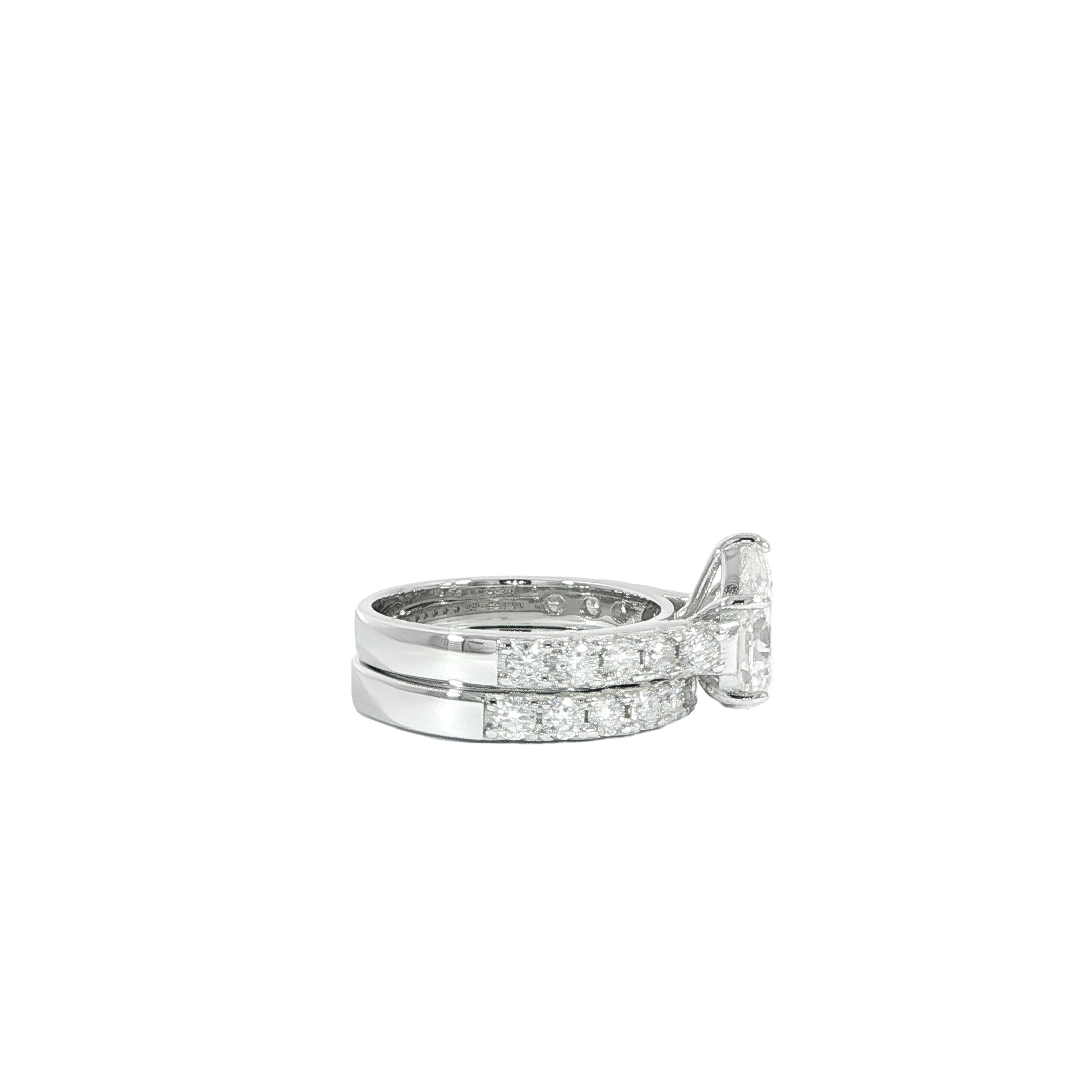 Pear shaped moissanite ring set with band side detail